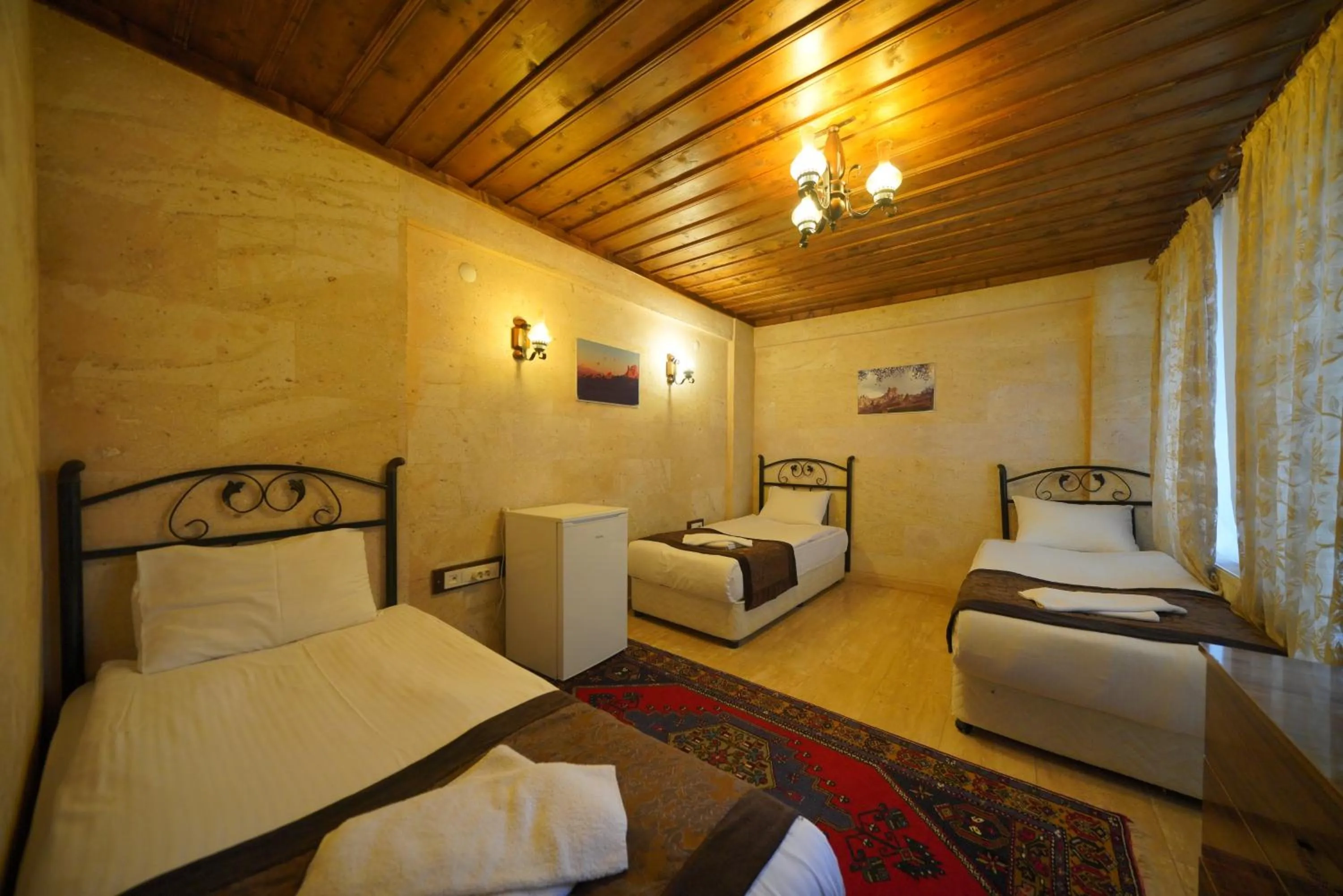 Bed in Goreme Cave Rooms&Pool
