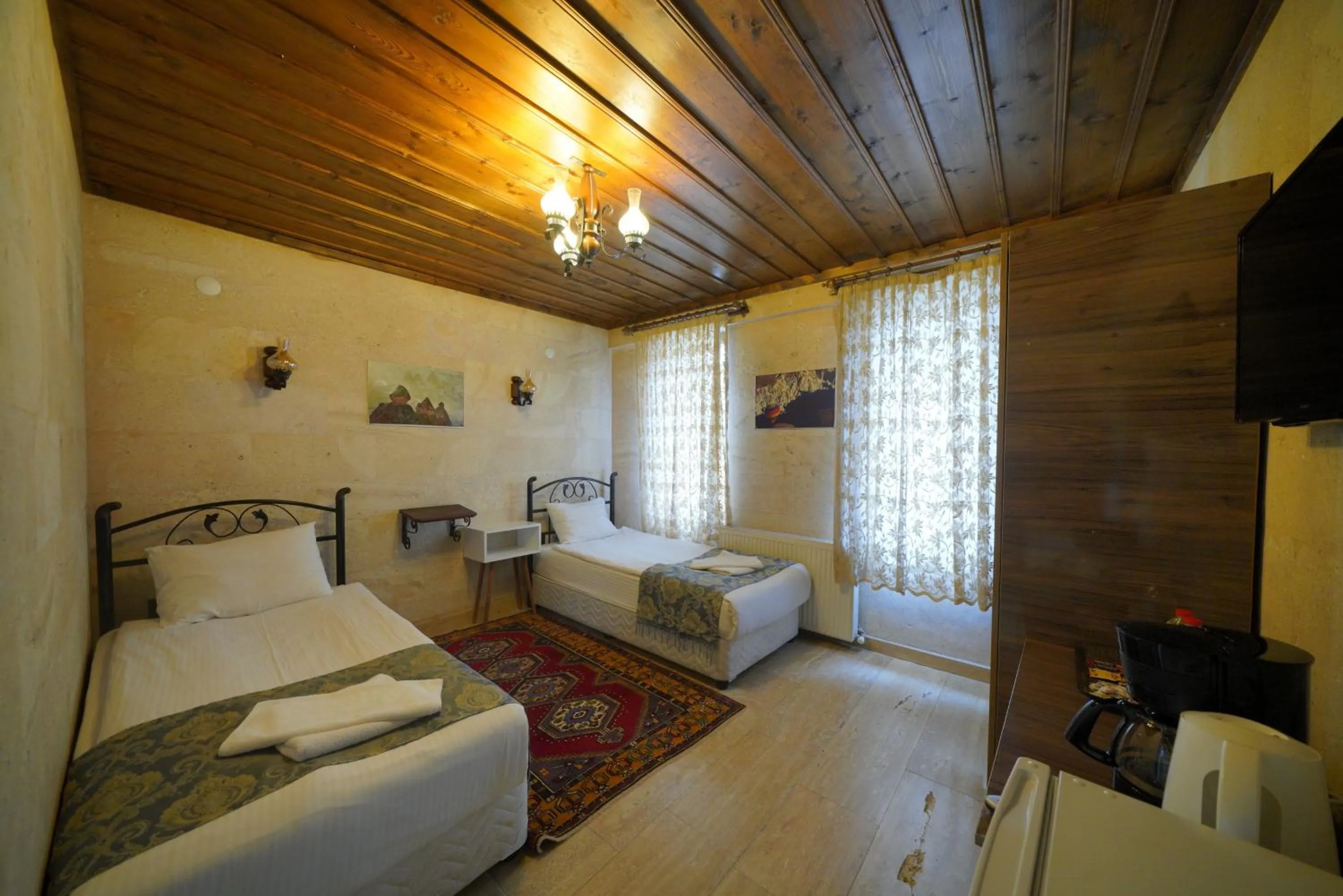 Bed in Goreme Cave Rooms&Pool