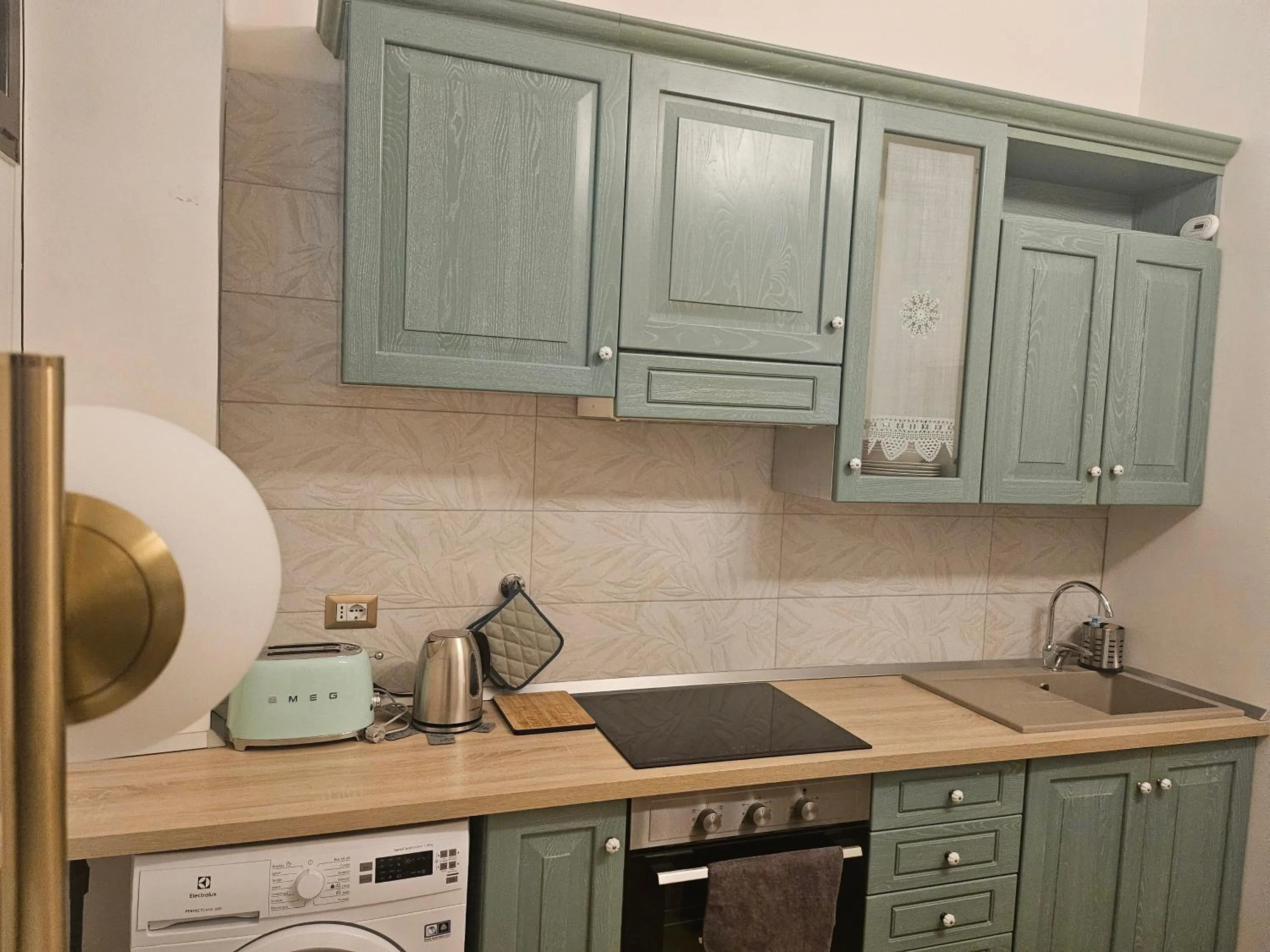 kitchen in Merulana Suite Apartment