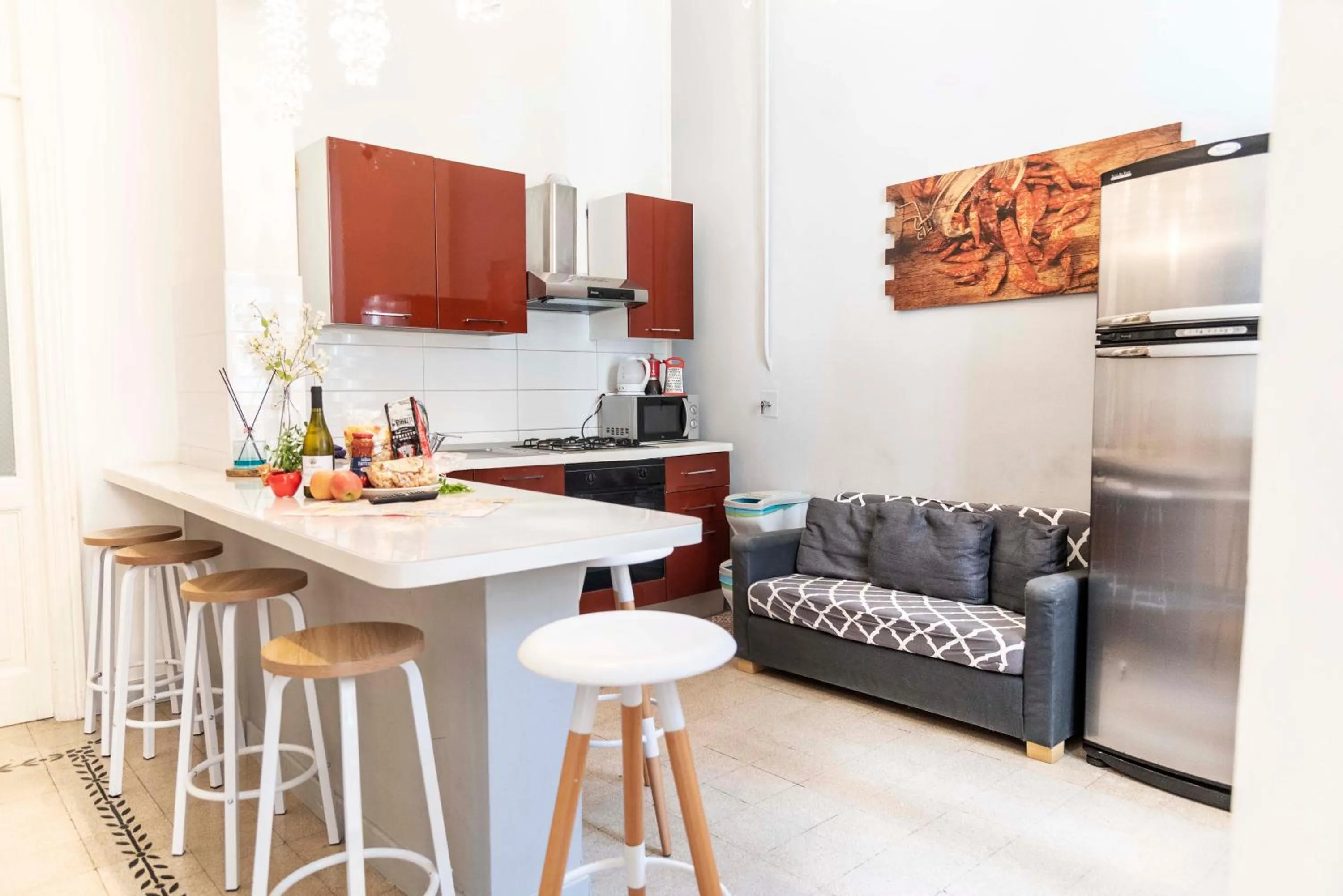 Kitchen or kitchenette in Merulana Suite Apartment