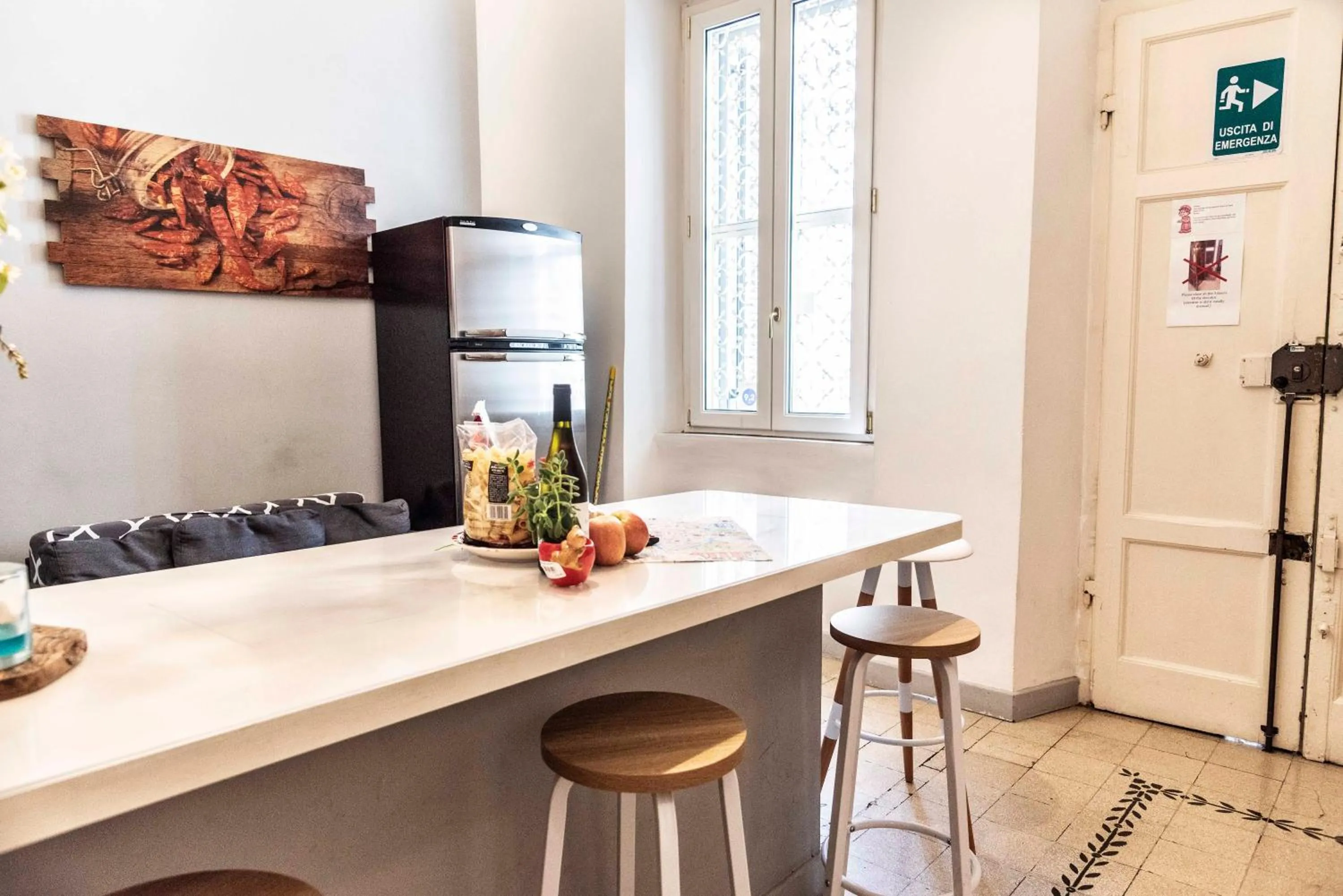 Kitchen or kitchenette in Merulana Suite Apartment