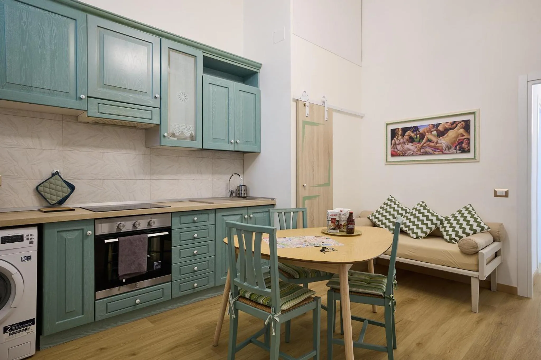 Kitchen or kitchenette in Merulana Suite Apartment