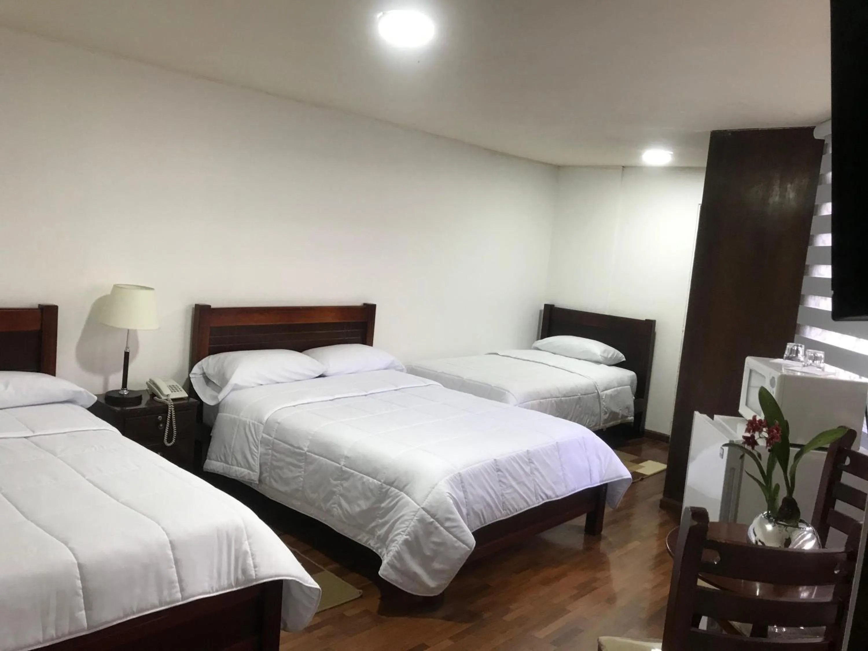 Bed in Altura Rooms & Suites