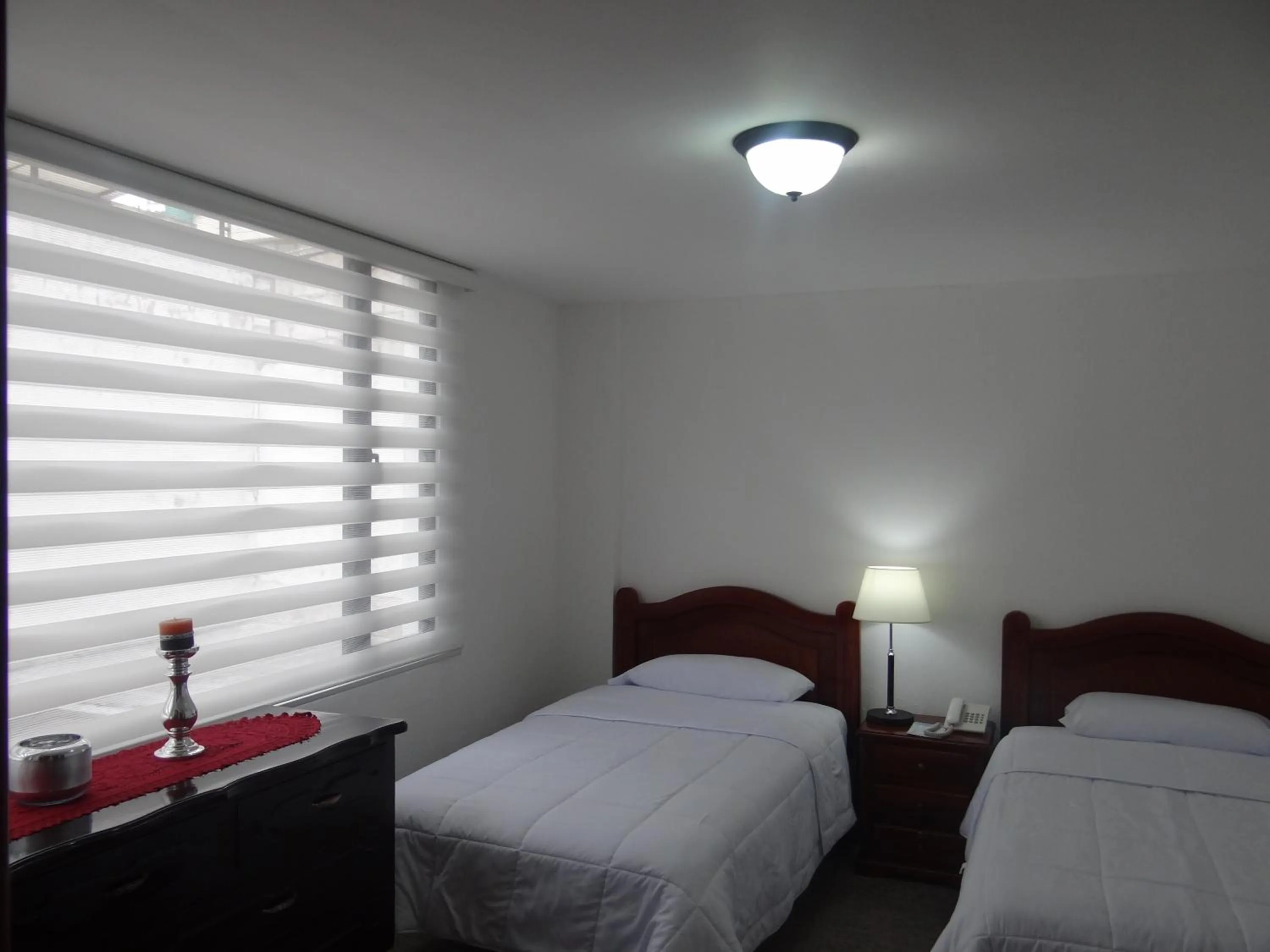 Bed in Altura Rooms & Suites