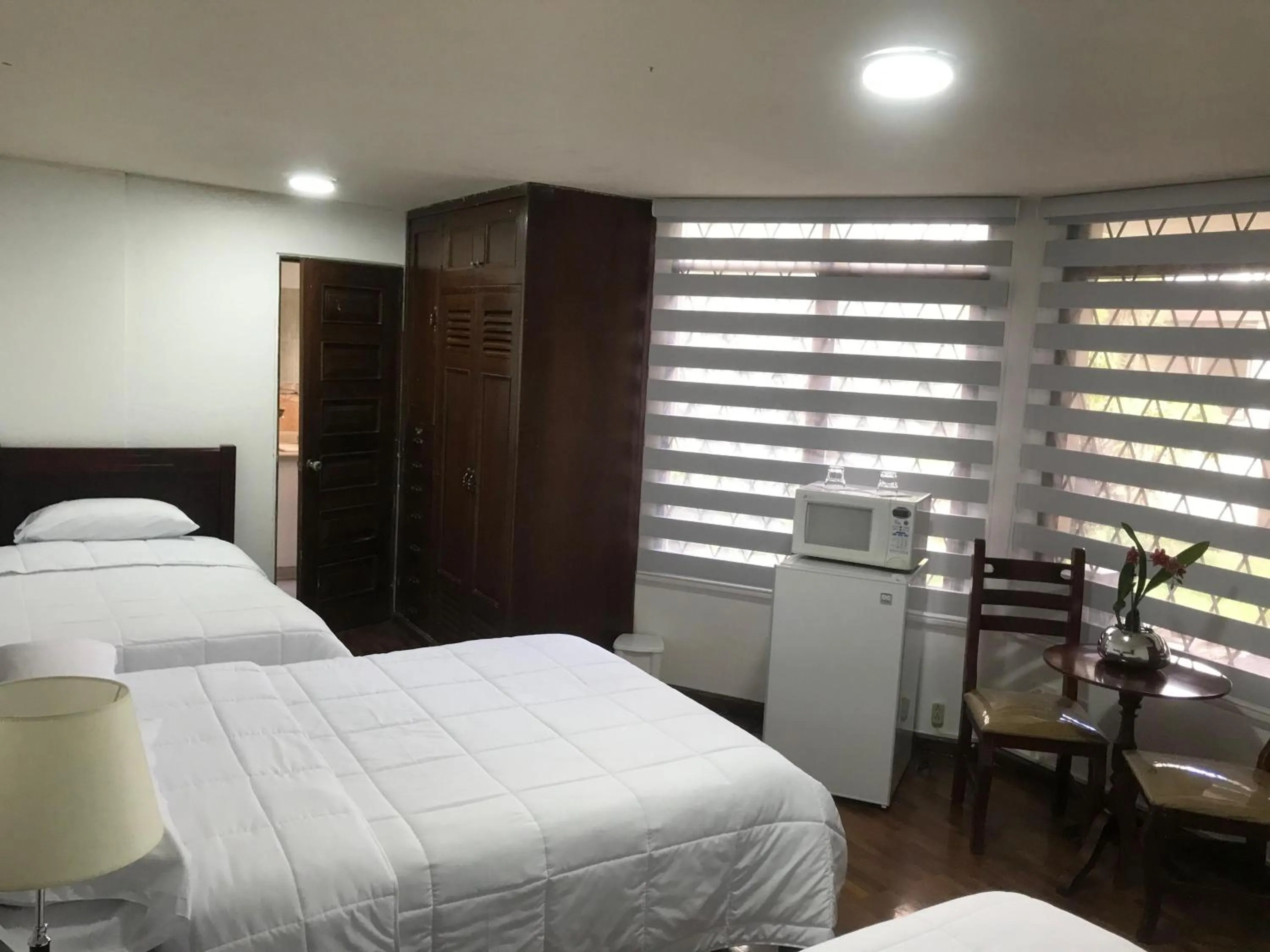 Bed in Altura Rooms & Suites