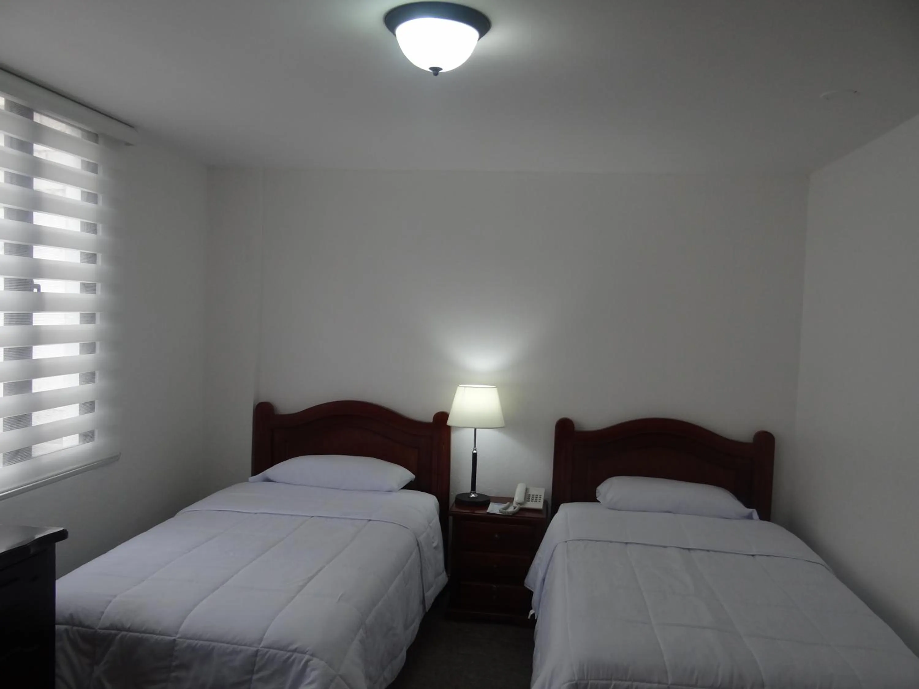 Bed in Altura Rooms & Suites