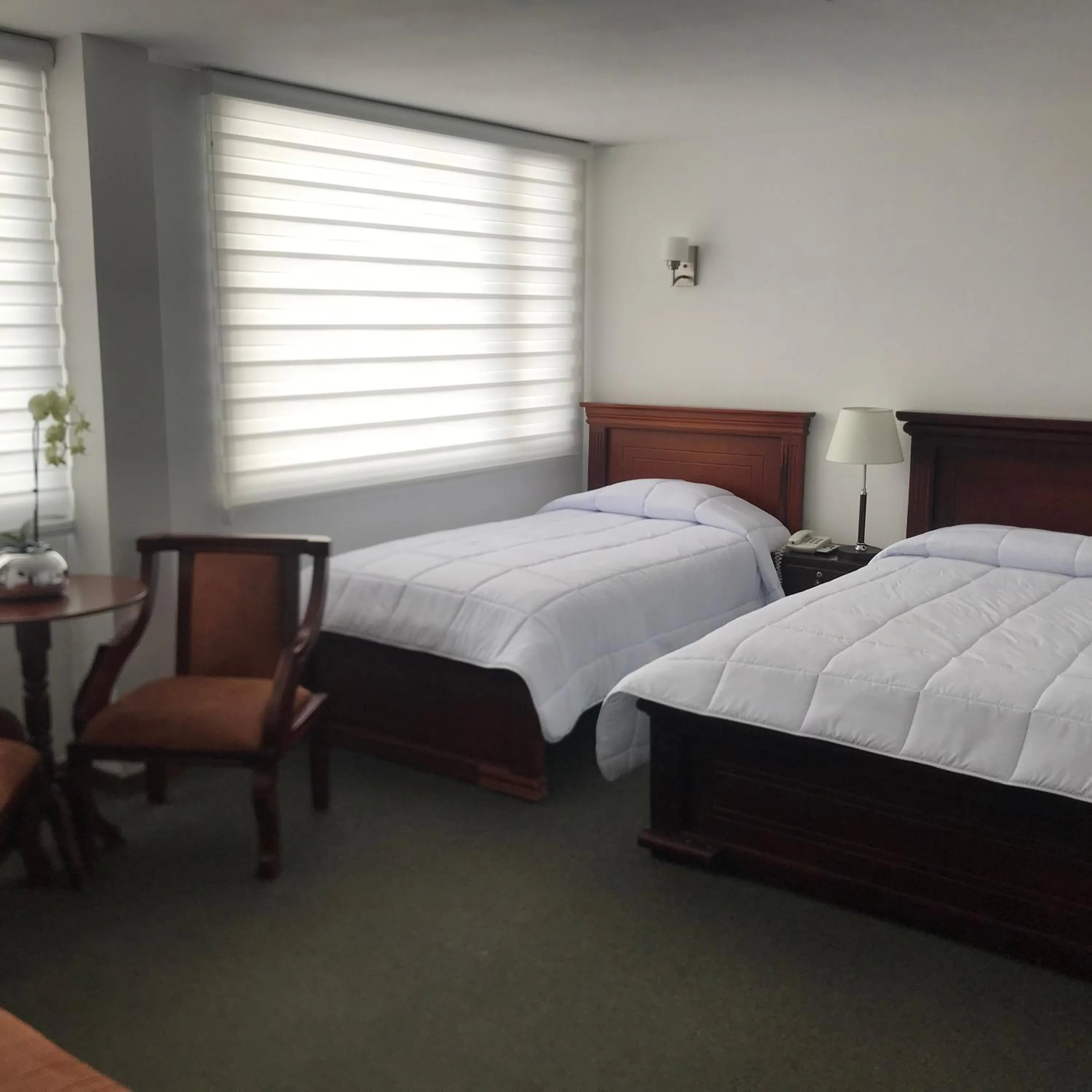 Bed in Altura Rooms & Suites