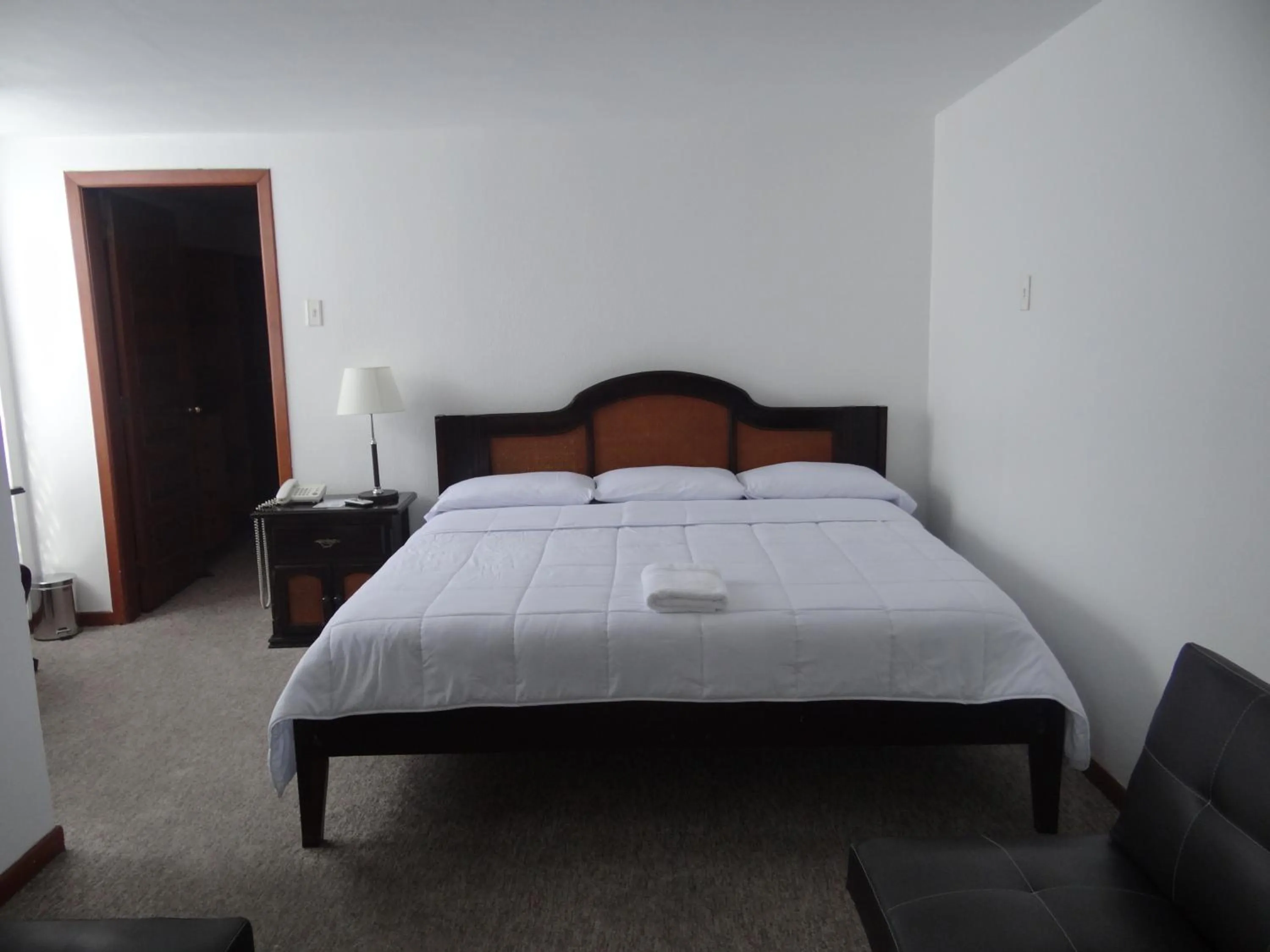 Bed in Altura Rooms & Suites