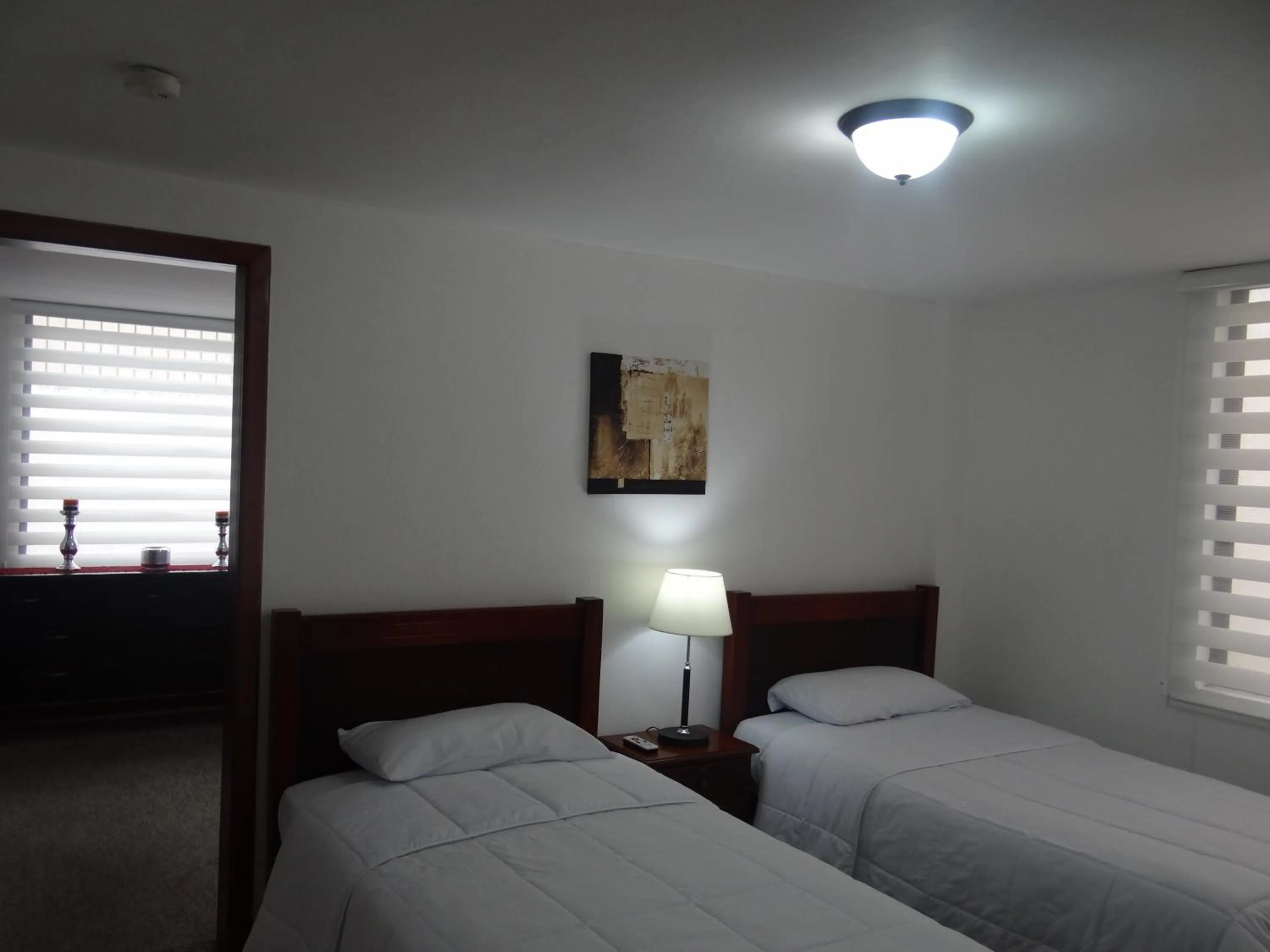 Bed in Altura Rooms & Suites