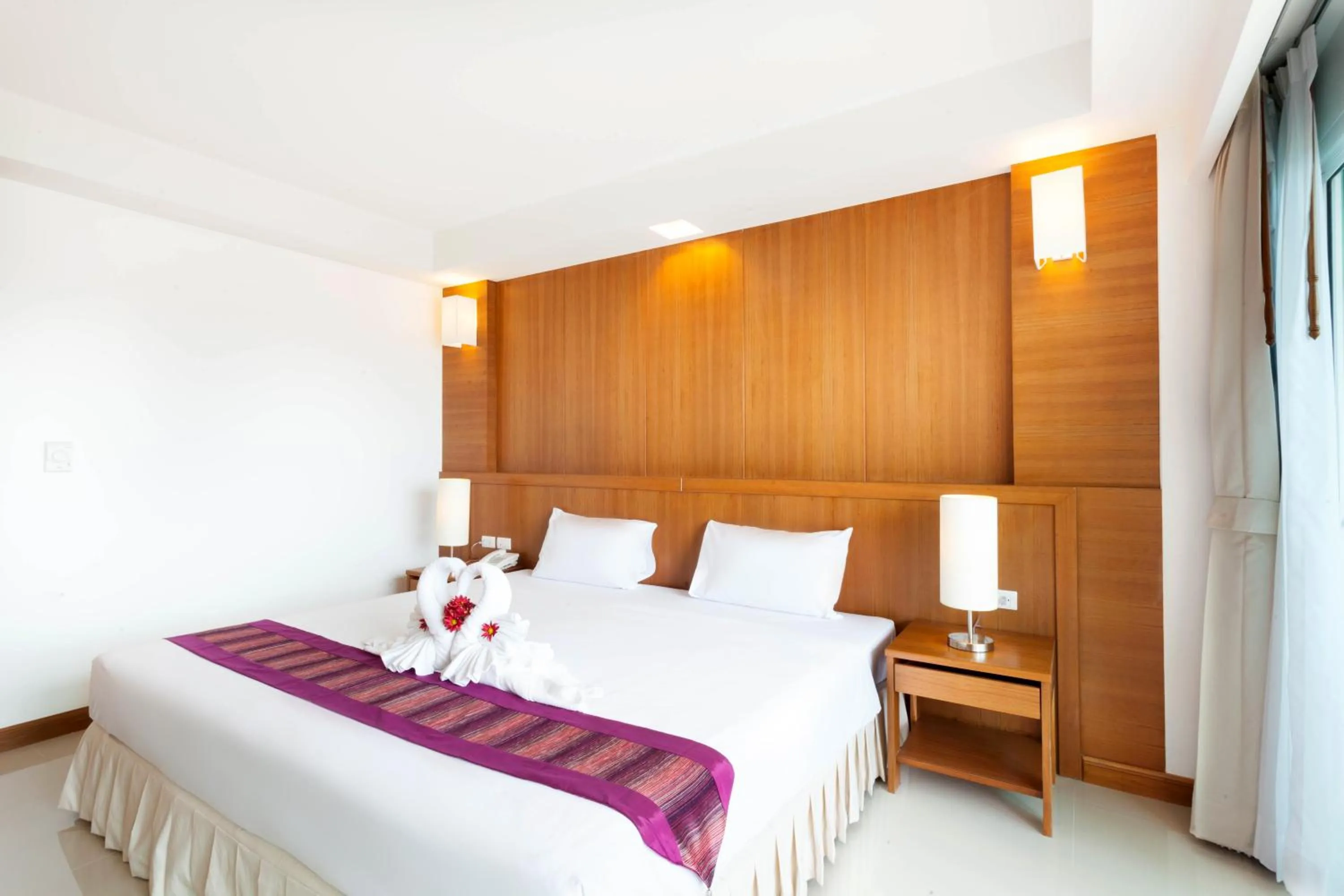 Bed in Rawai Princess Hotel