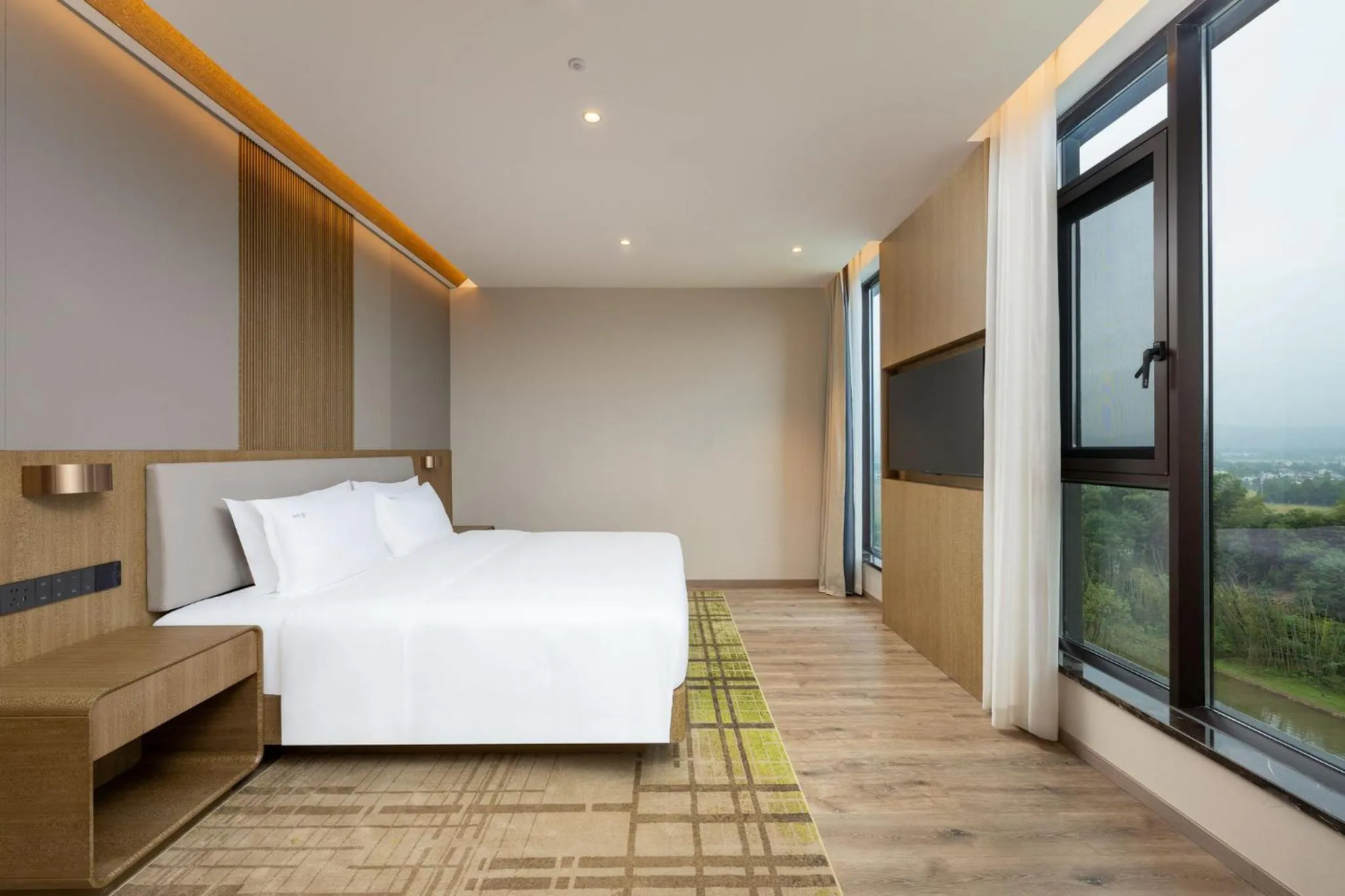 Photo of the whole room, Bed in Holiday Inn Jiuhua Mountain Hot Spring by IHG