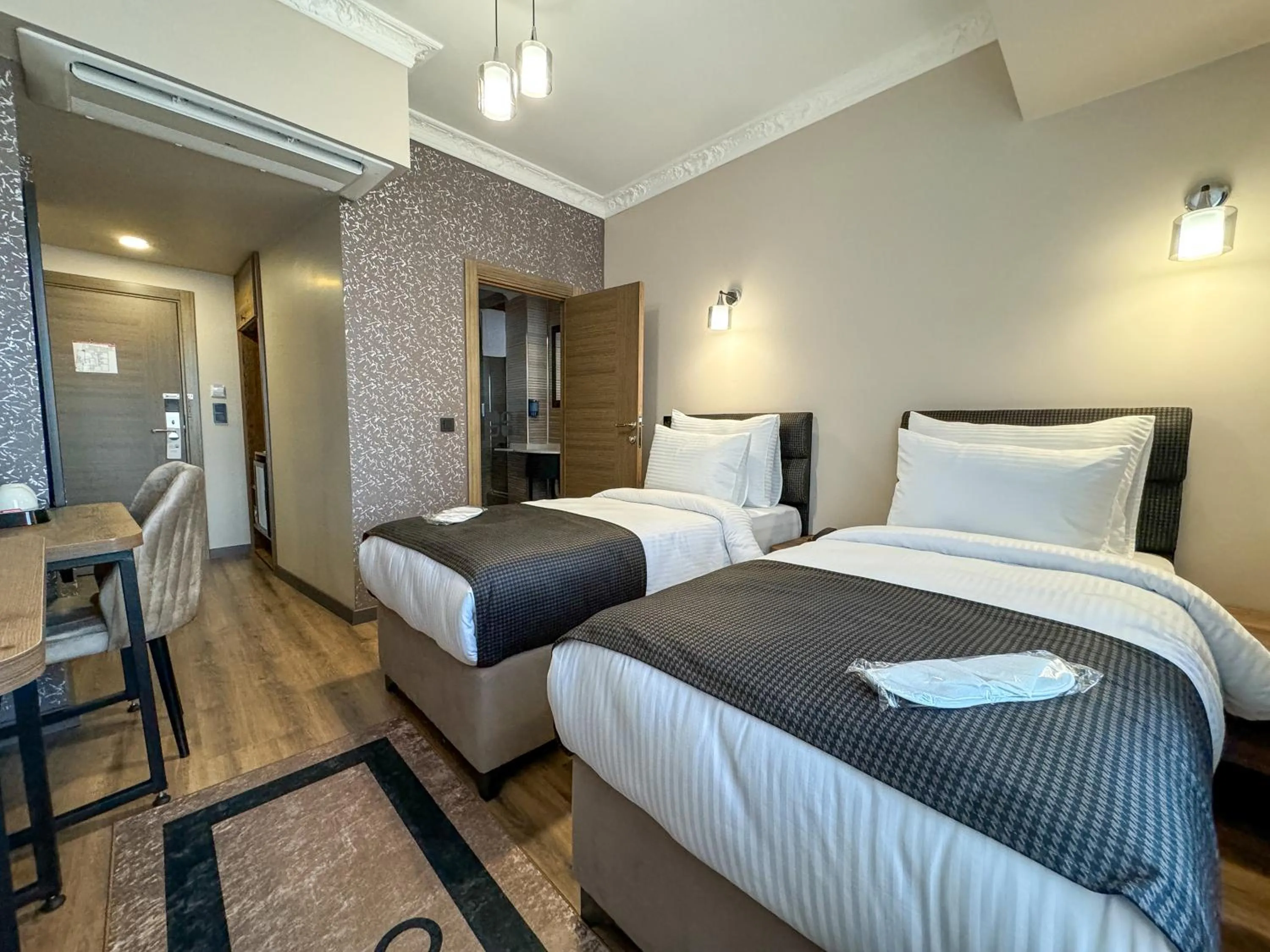 Bed in Grand CLOVER Hotel