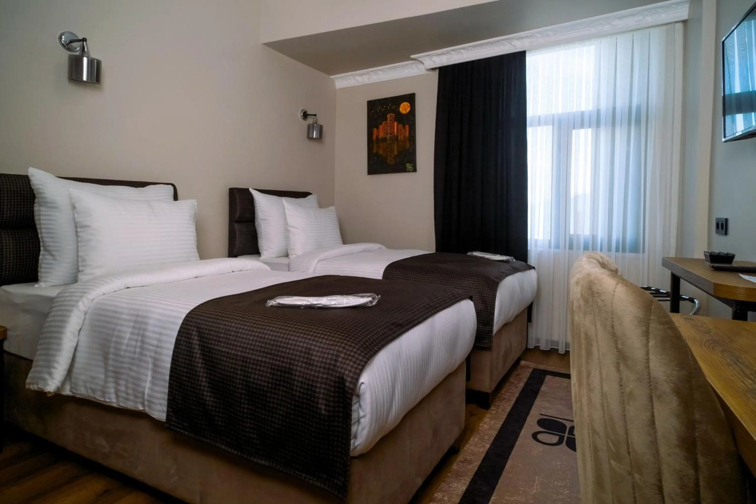 Bed in Grand CLOVER Hotel