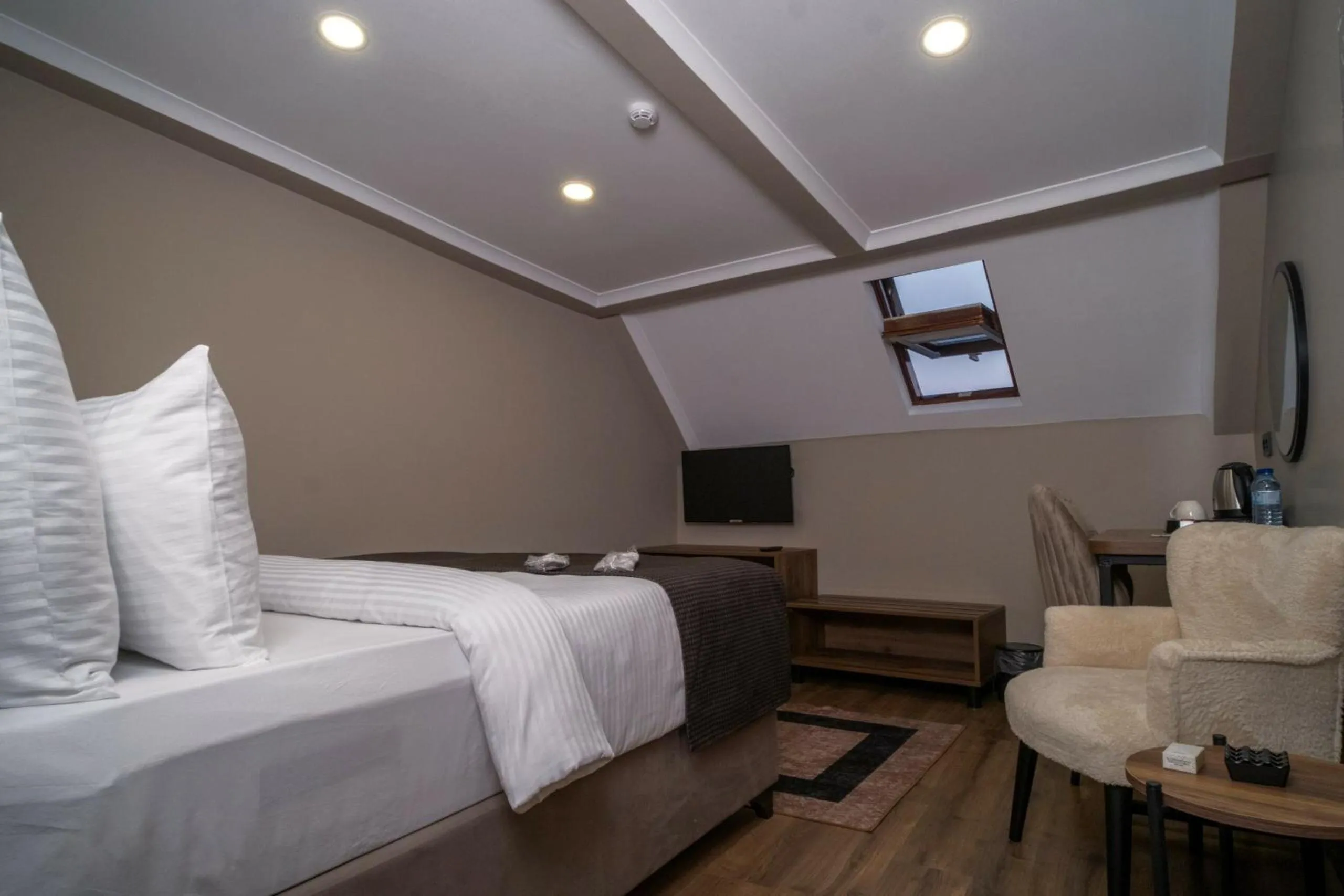 Bed in Grand CLOVER Hotel