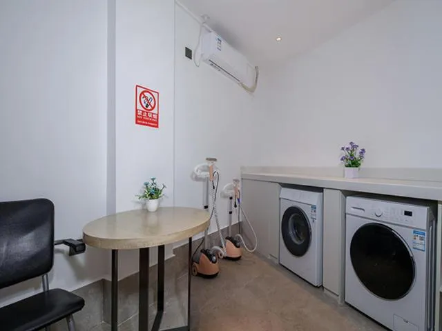washing machine in Echarm Hotel Mile Branch