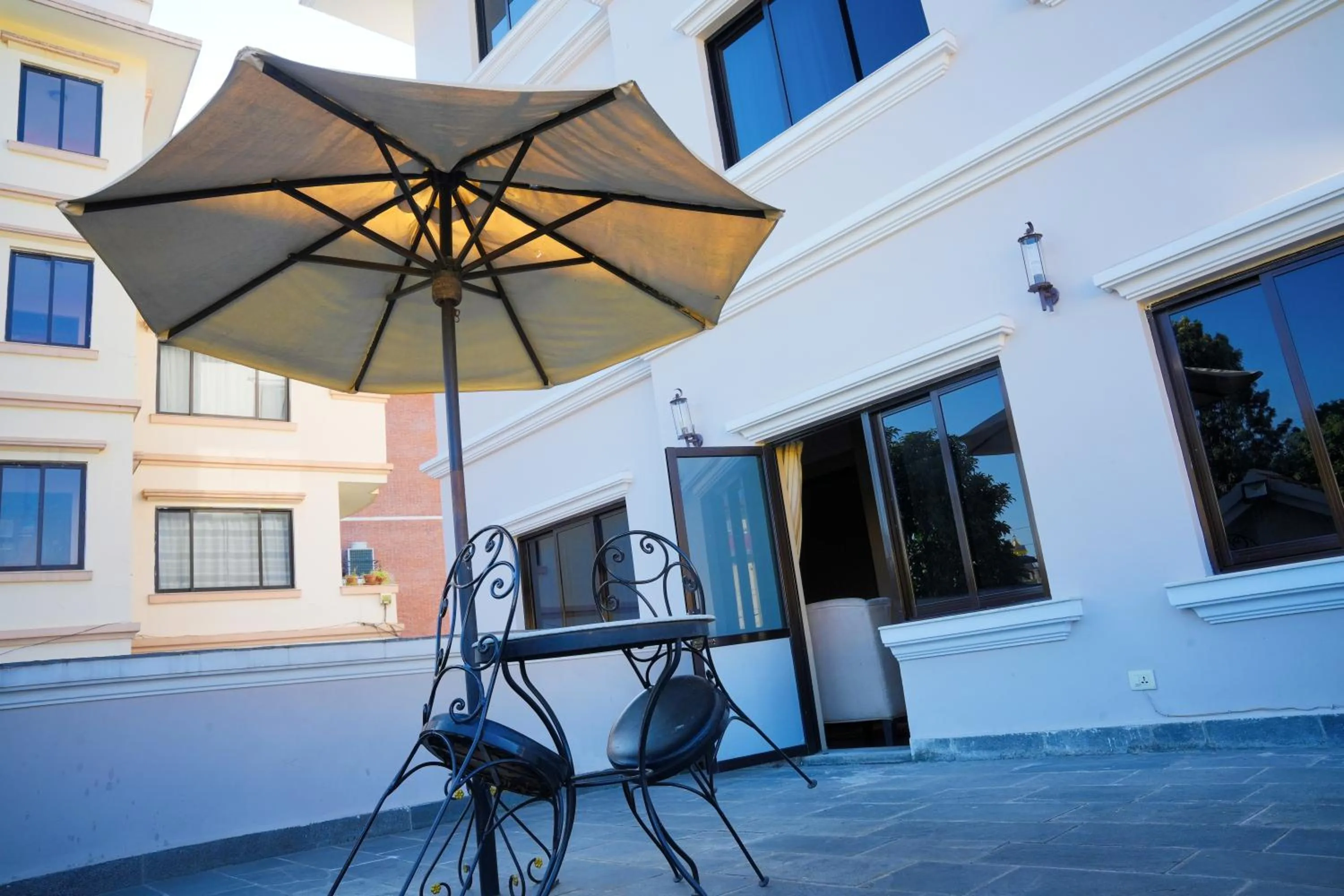 Balcony/Terrace in Hotel Harmika - Spiritual retreat with garden & Stupa view