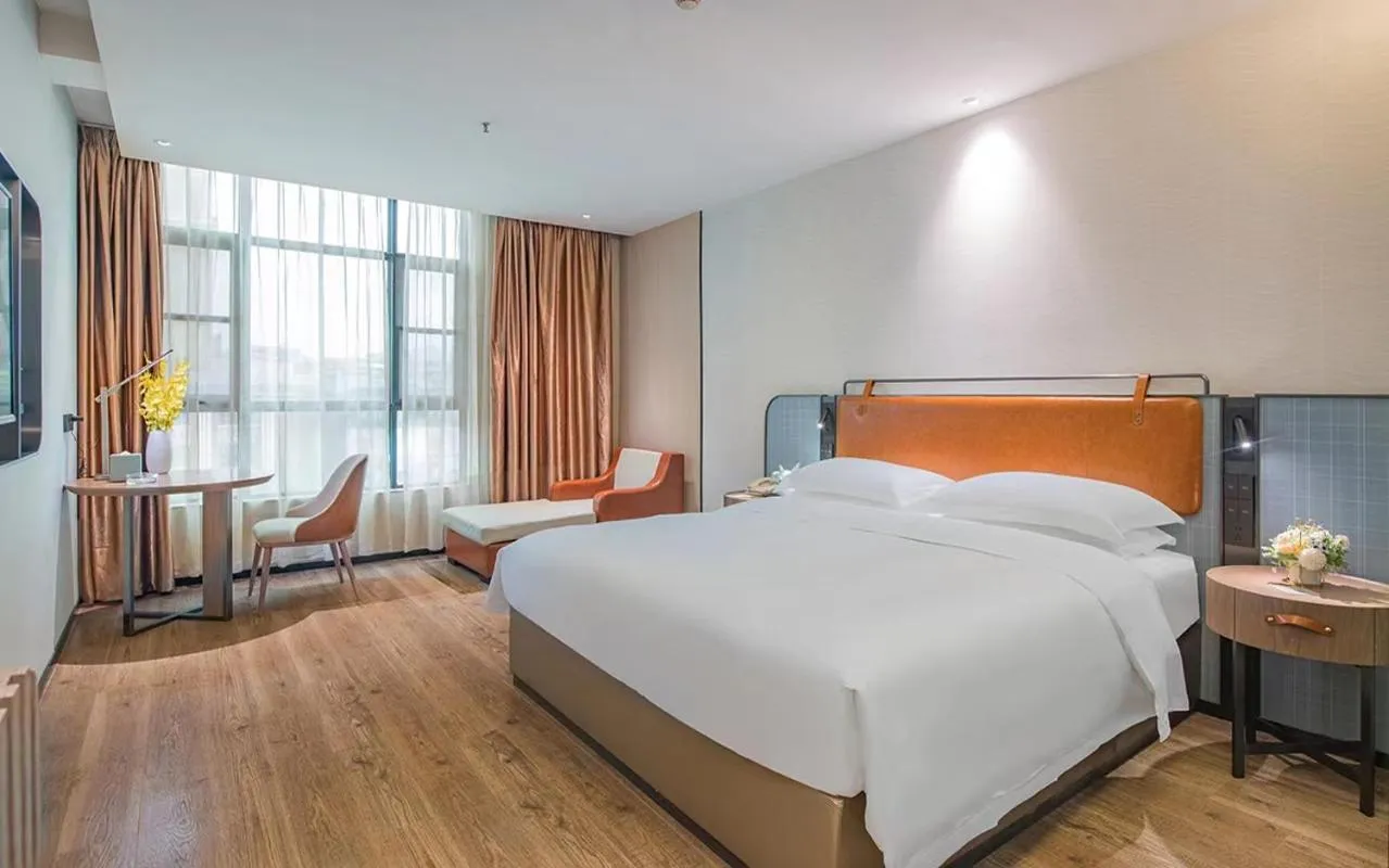 Bed in Echarm Hotel Guangzhou Jiahe Helong Branch