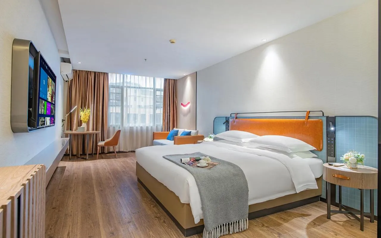 Bed in Echarm Hotel Guangzhou Jiahe Helong Branch