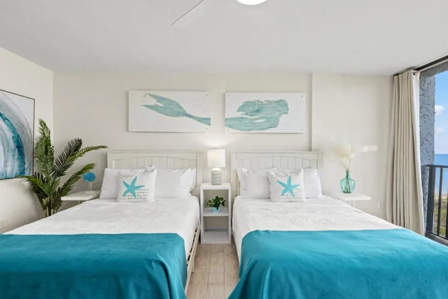 Bed in Sandpiper Beacon Beach Resort