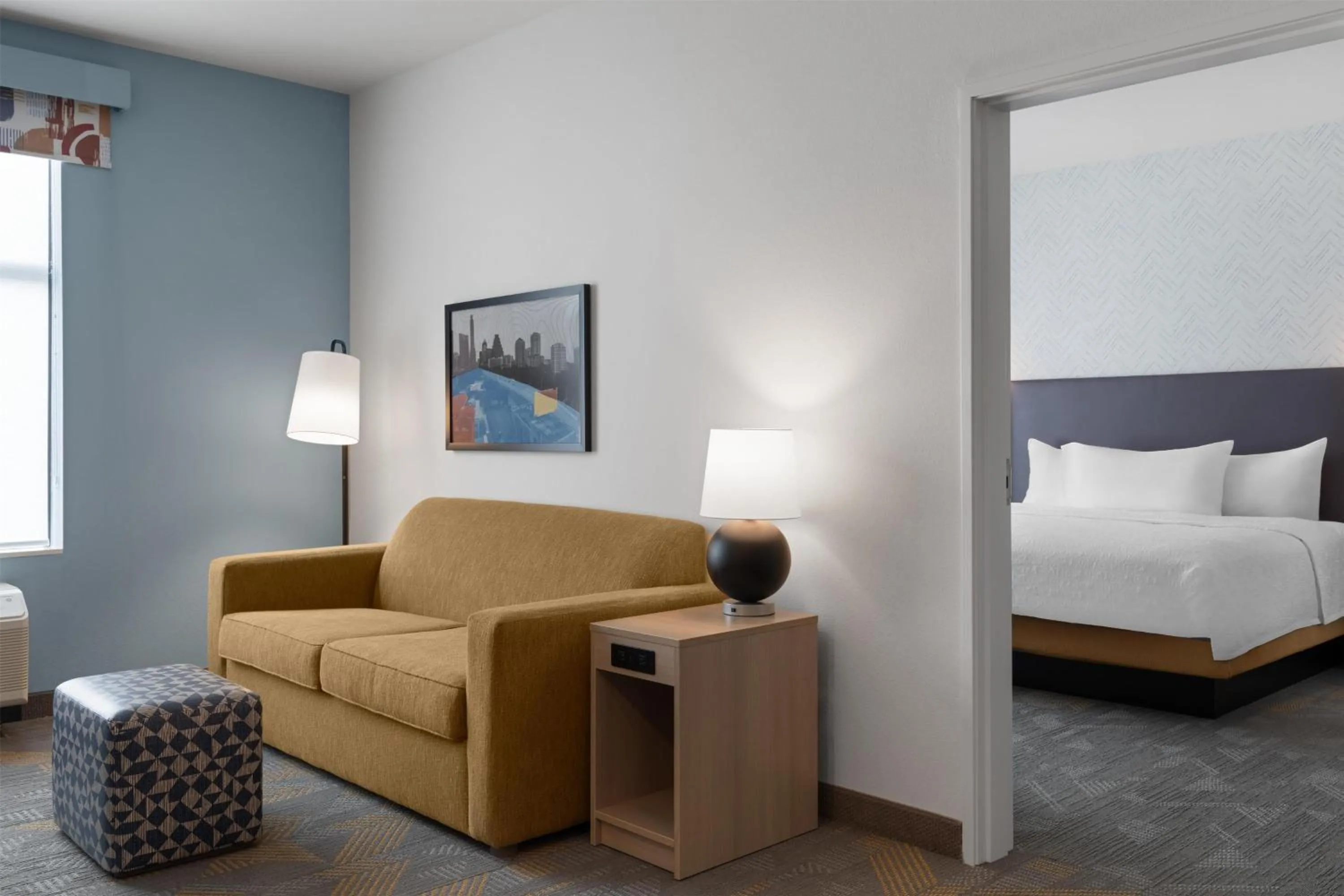 Living room, Bed in Home2 Suites By Hilton Austin South