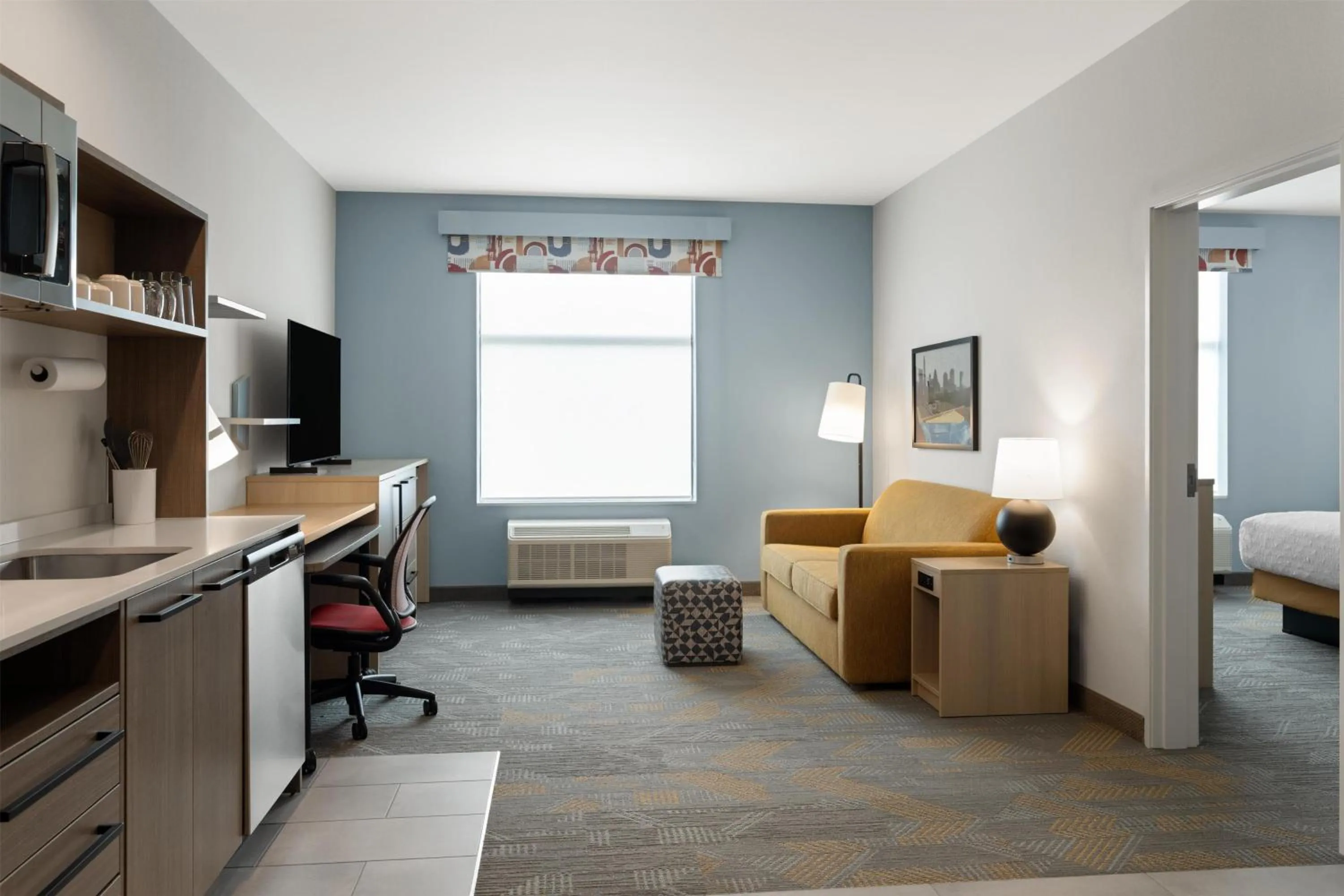 Living room, Bed in Home2 Suites By Hilton Austin South