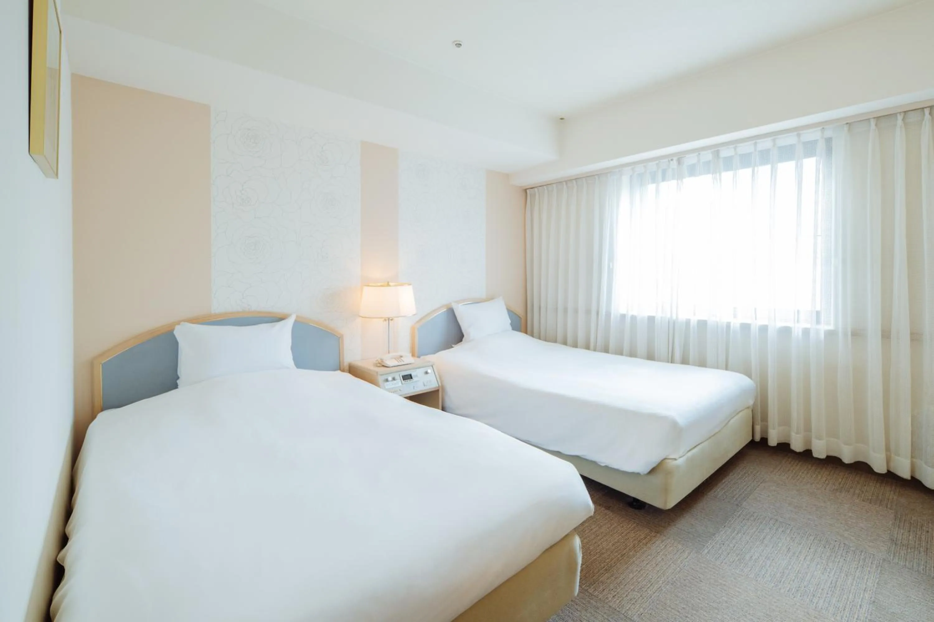 Bed in Nest Hotel Matsuyama