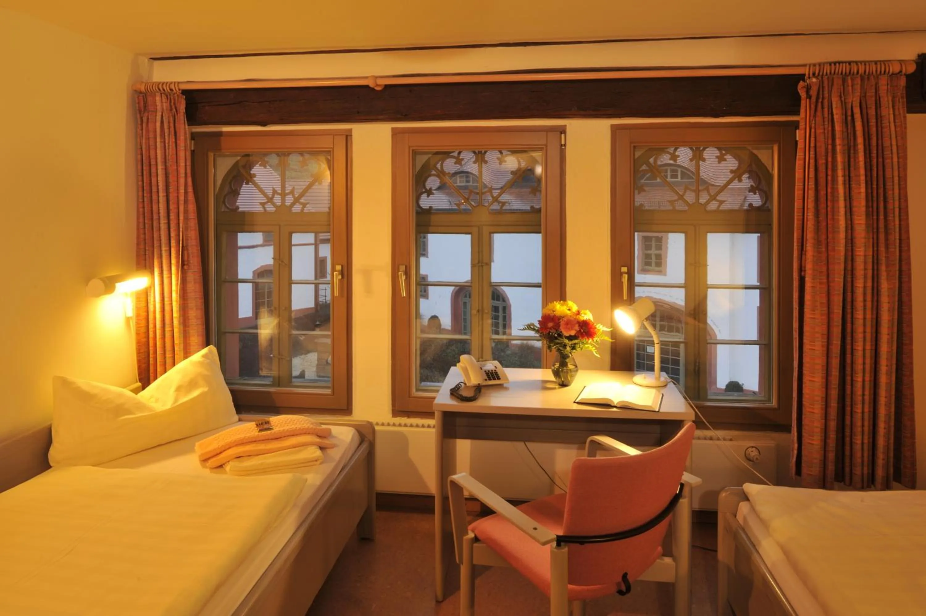 Photo of the whole room, Bed in Gästehäuser St. Marienthal