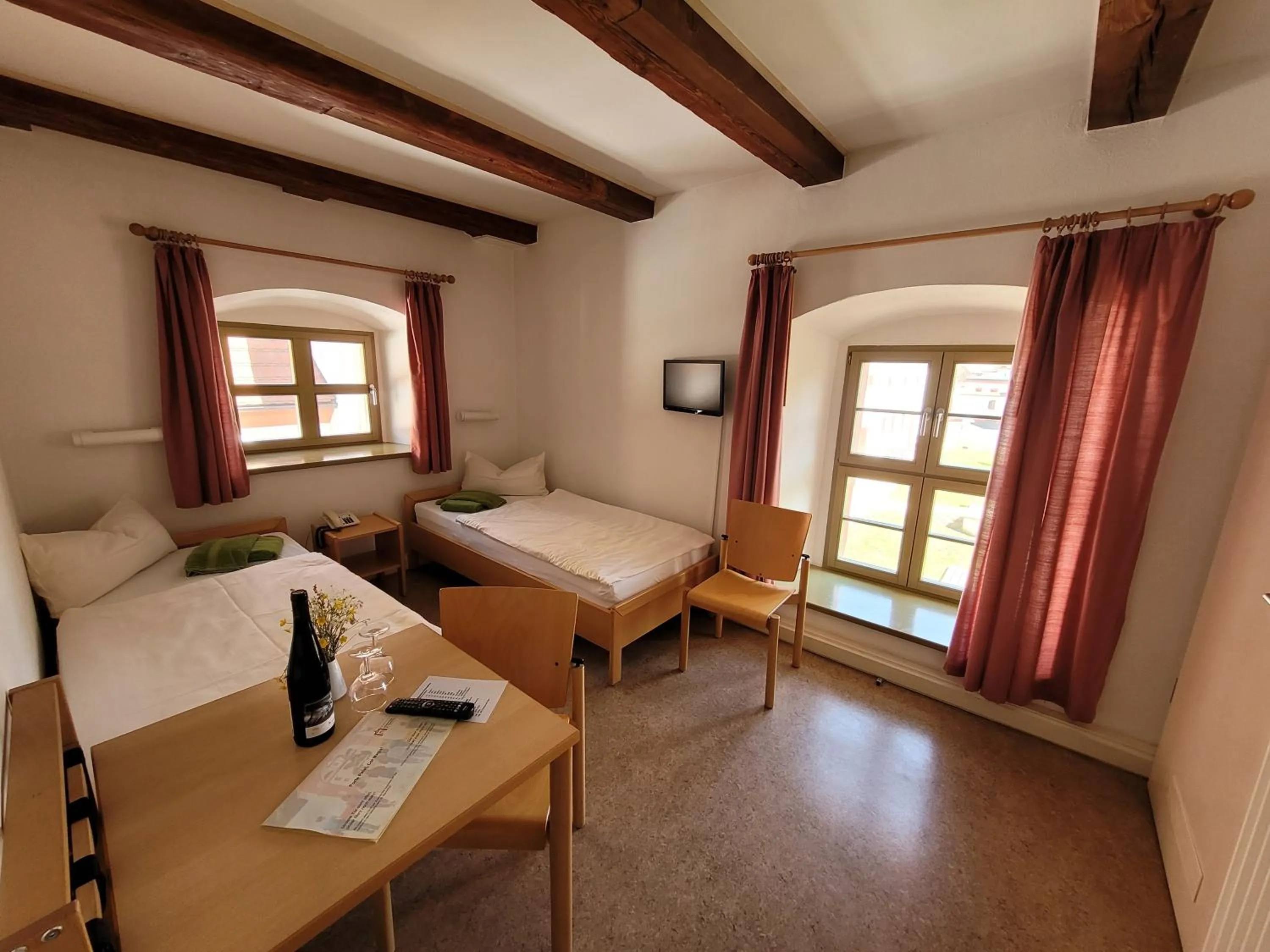 Photo of the whole room, Bed in Gästehäuser St. Marienthal