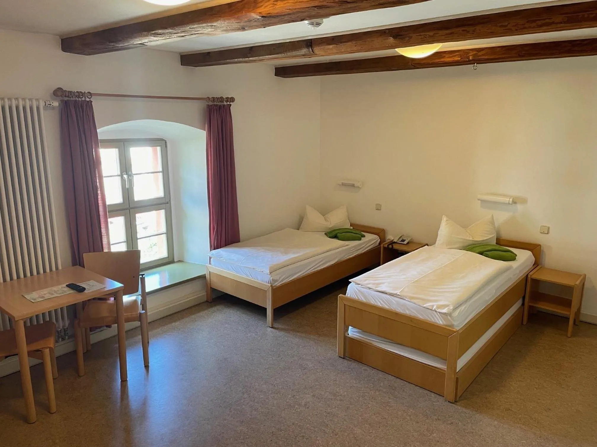 Photo of the whole room, Bed in Gästehäuser St. Marienthal