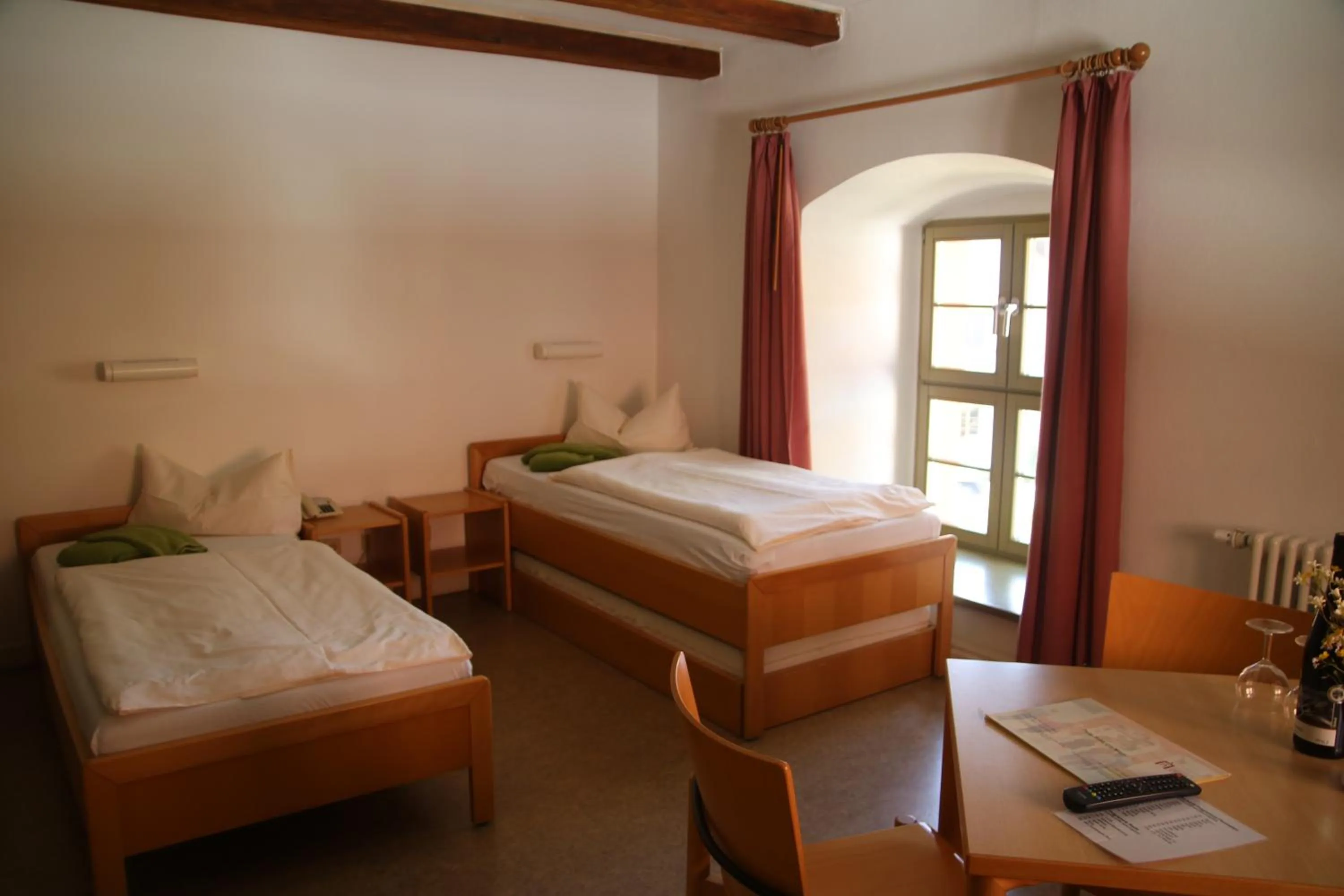 Photo of the whole room, Bed in Gästehäuser St. Marienthal