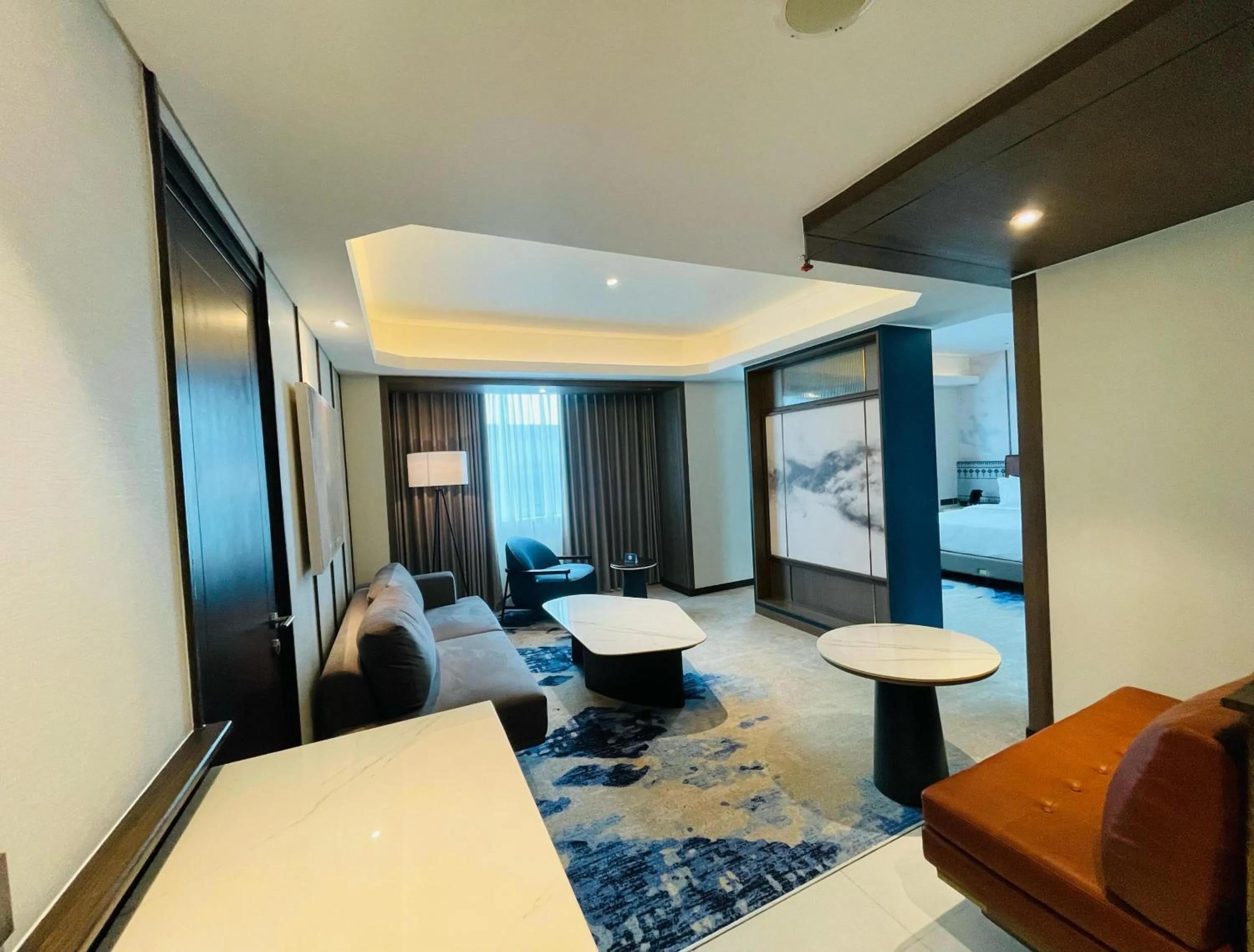 Living room, Bed in Grand Anara Airport Hotel