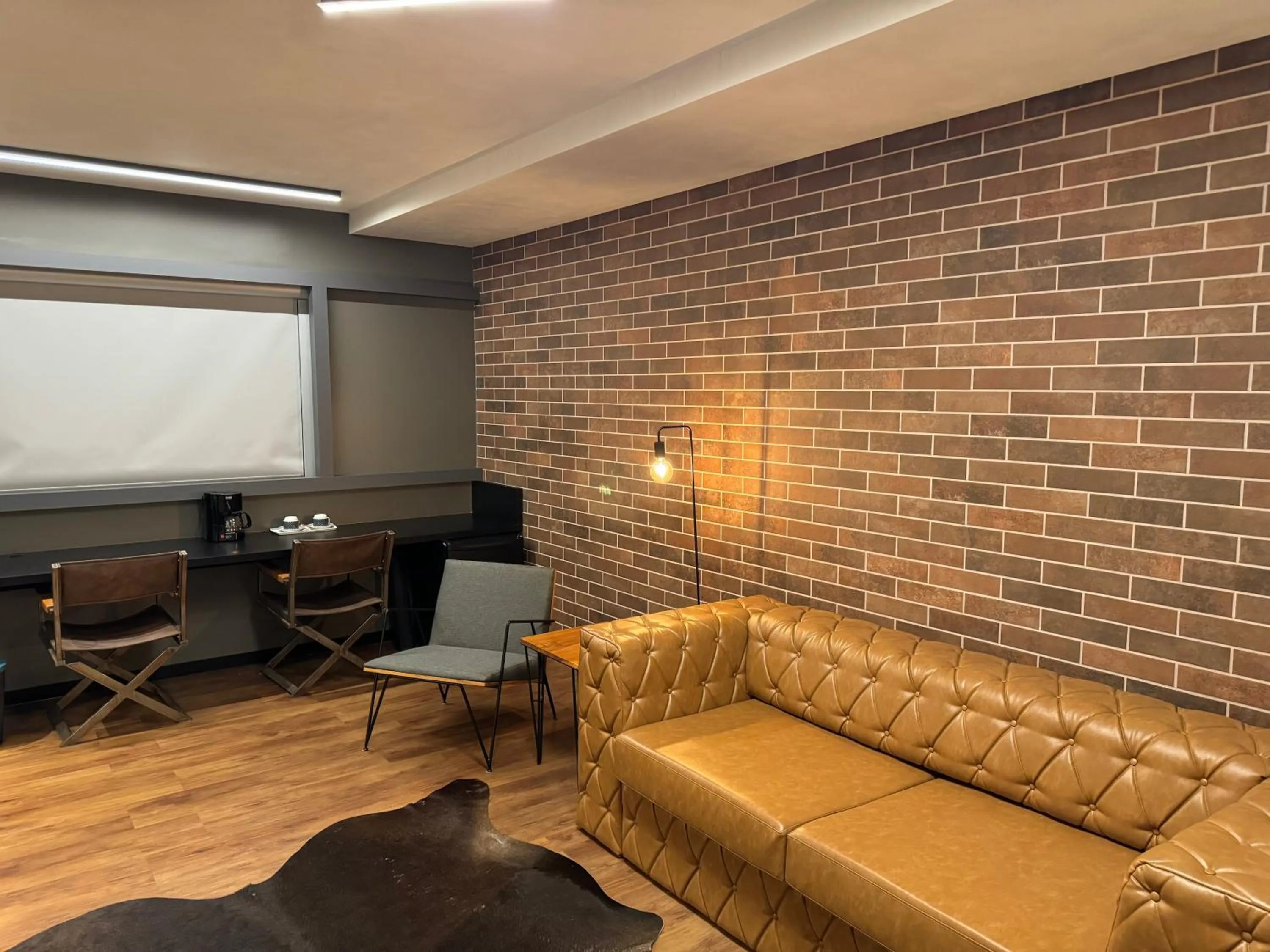 Living room in Mogano Premium Hotel - ELETROPOSTO