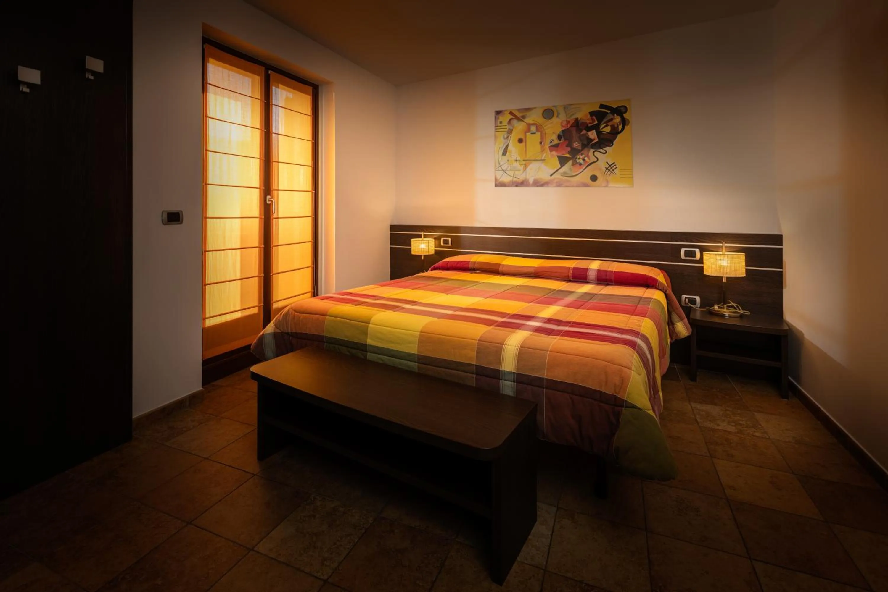 Bed in Al Fogolâr Rooms & Osteria with Saunaland
