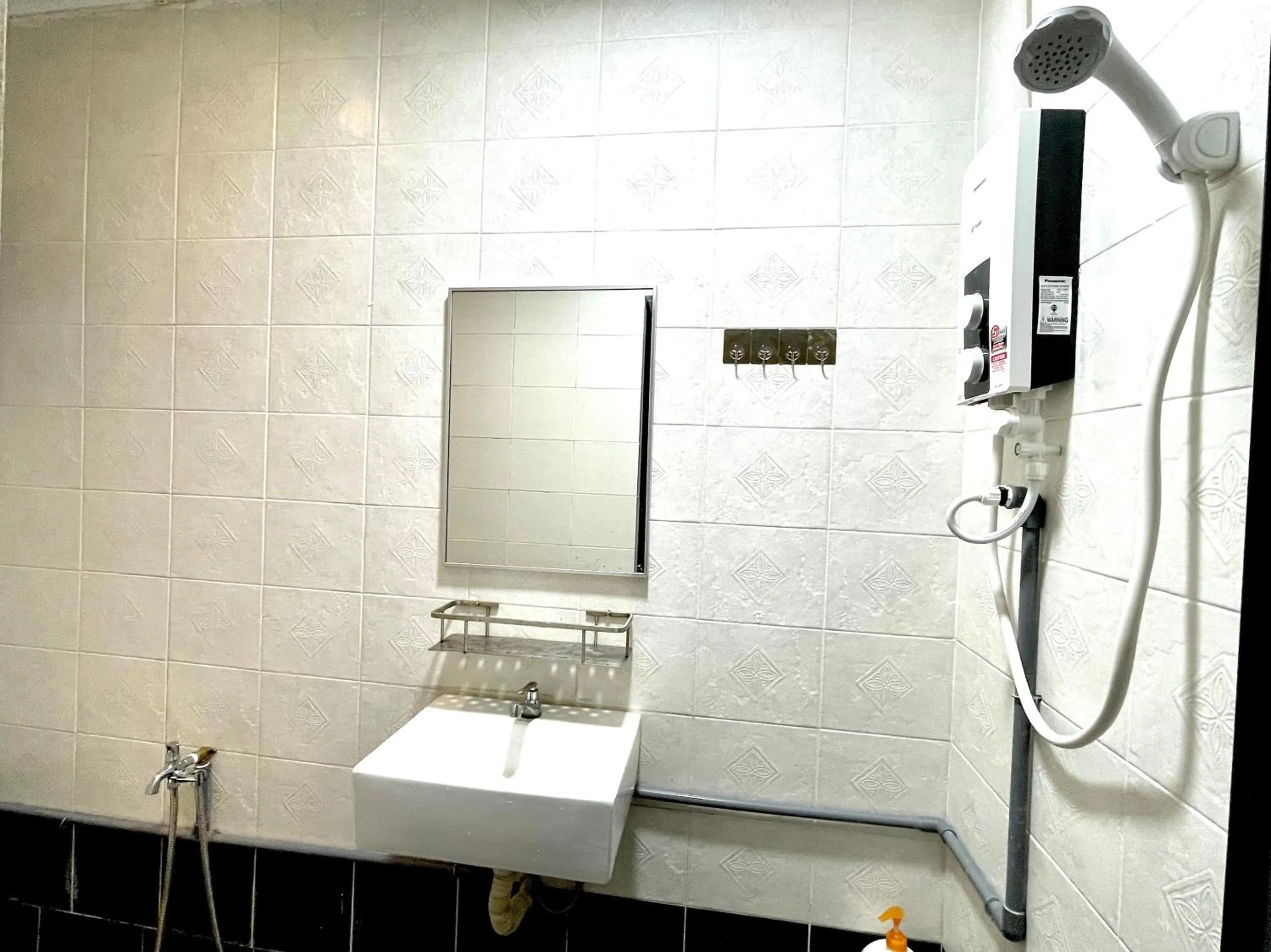 Bathroom in Hotel O S Homestay Premium