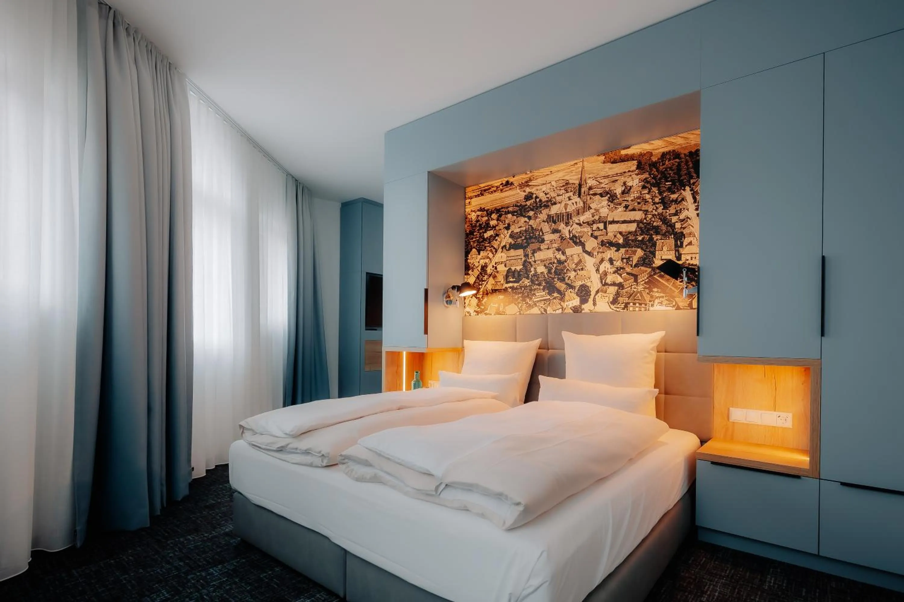 Photo of the whole room, Bed in Stadthöfe Rhede by Hackmann