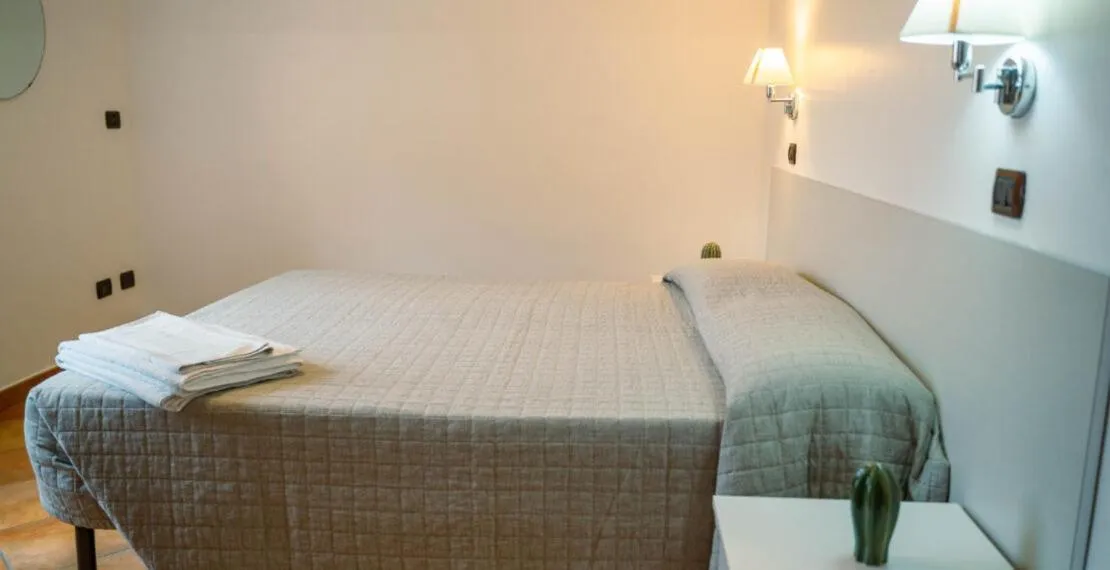 Bed in Le Tartarughe Aparthotel