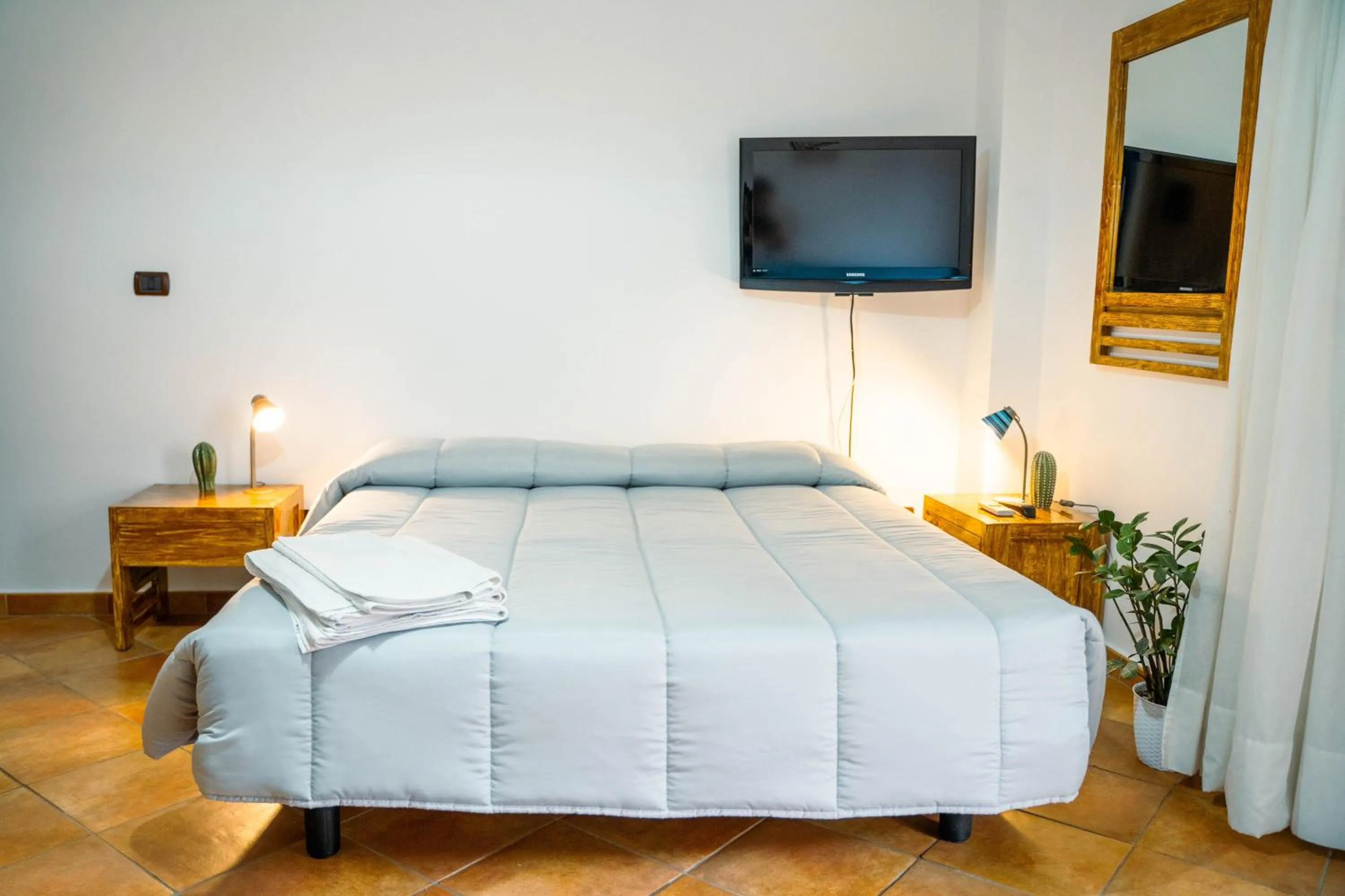 Bed in Le Tartarughe Aparthotel