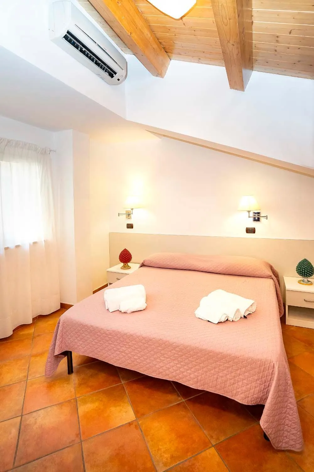 Bed in Le Tartarughe Aparthotel