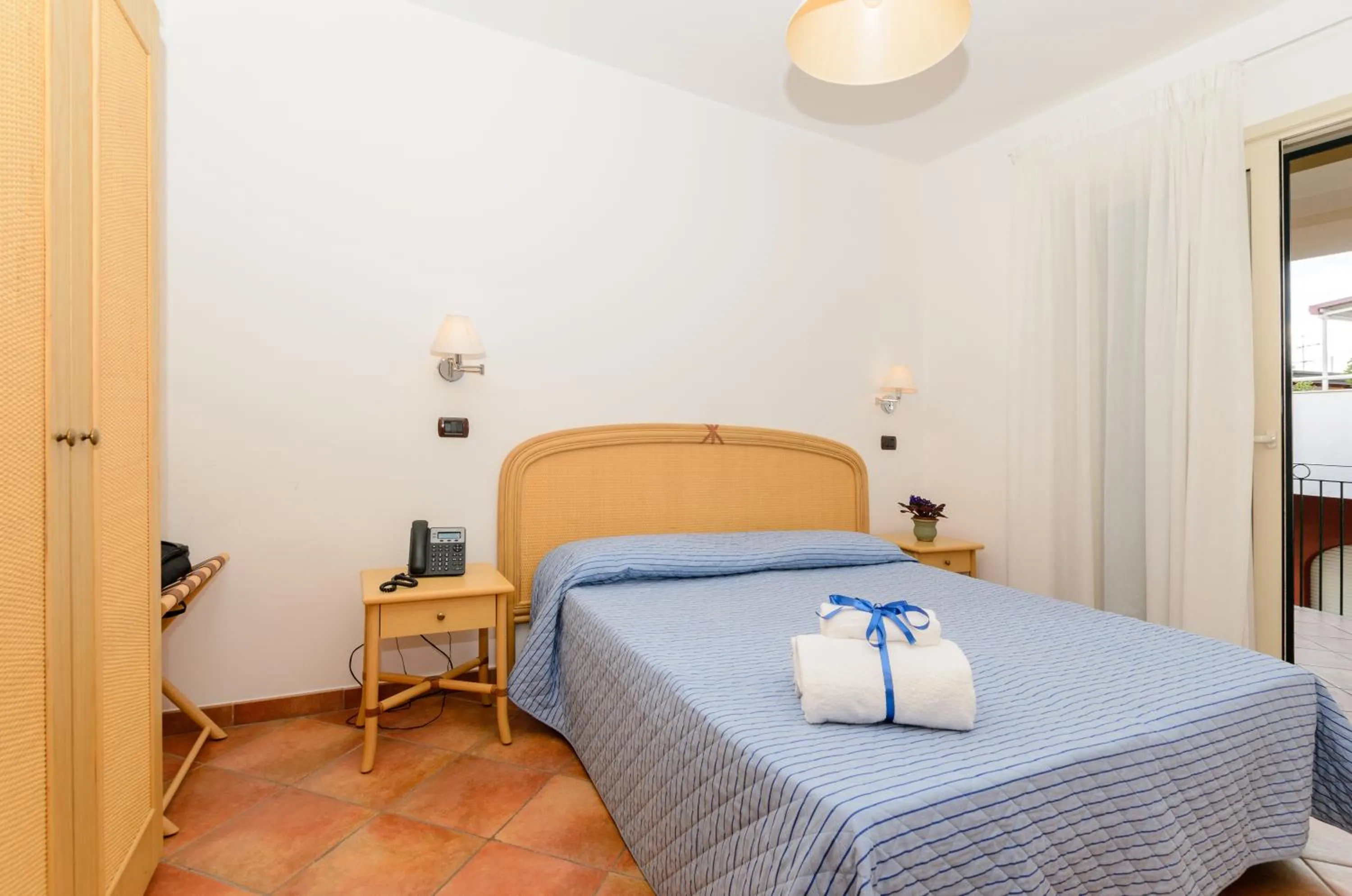 Bed in Le Tartarughe Aparthotel