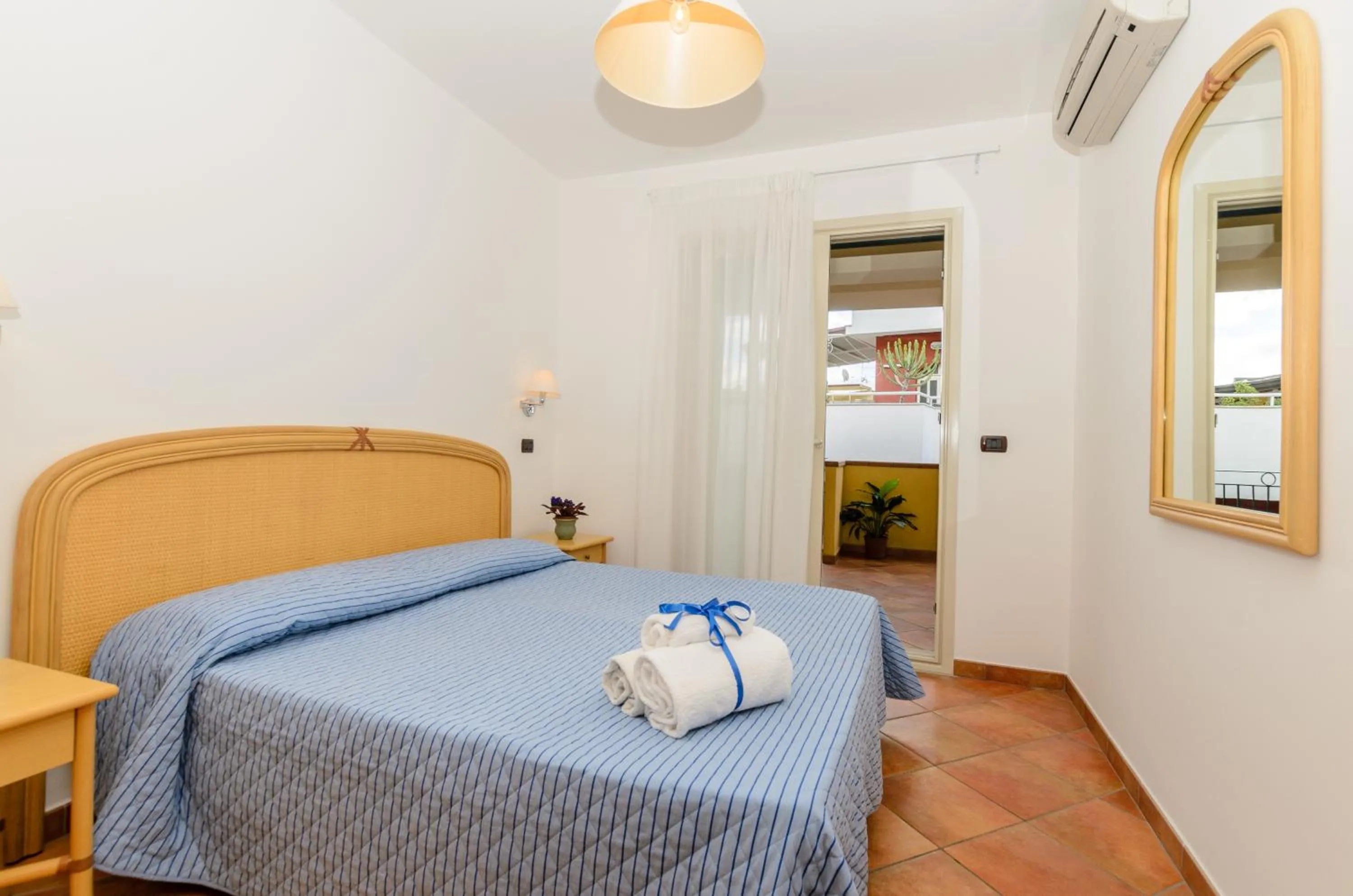 Bed in Le Tartarughe Aparthotel