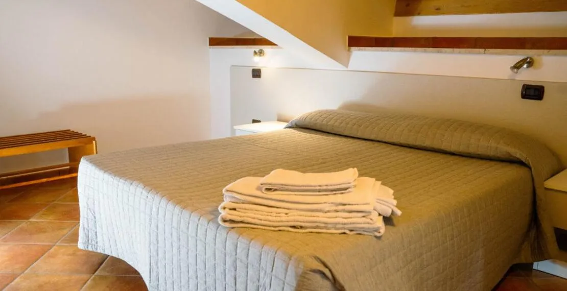 Bed in Le Tartarughe Aparthotel