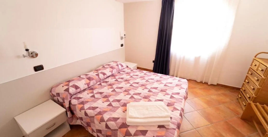 Bed in Le Tartarughe Aparthotel