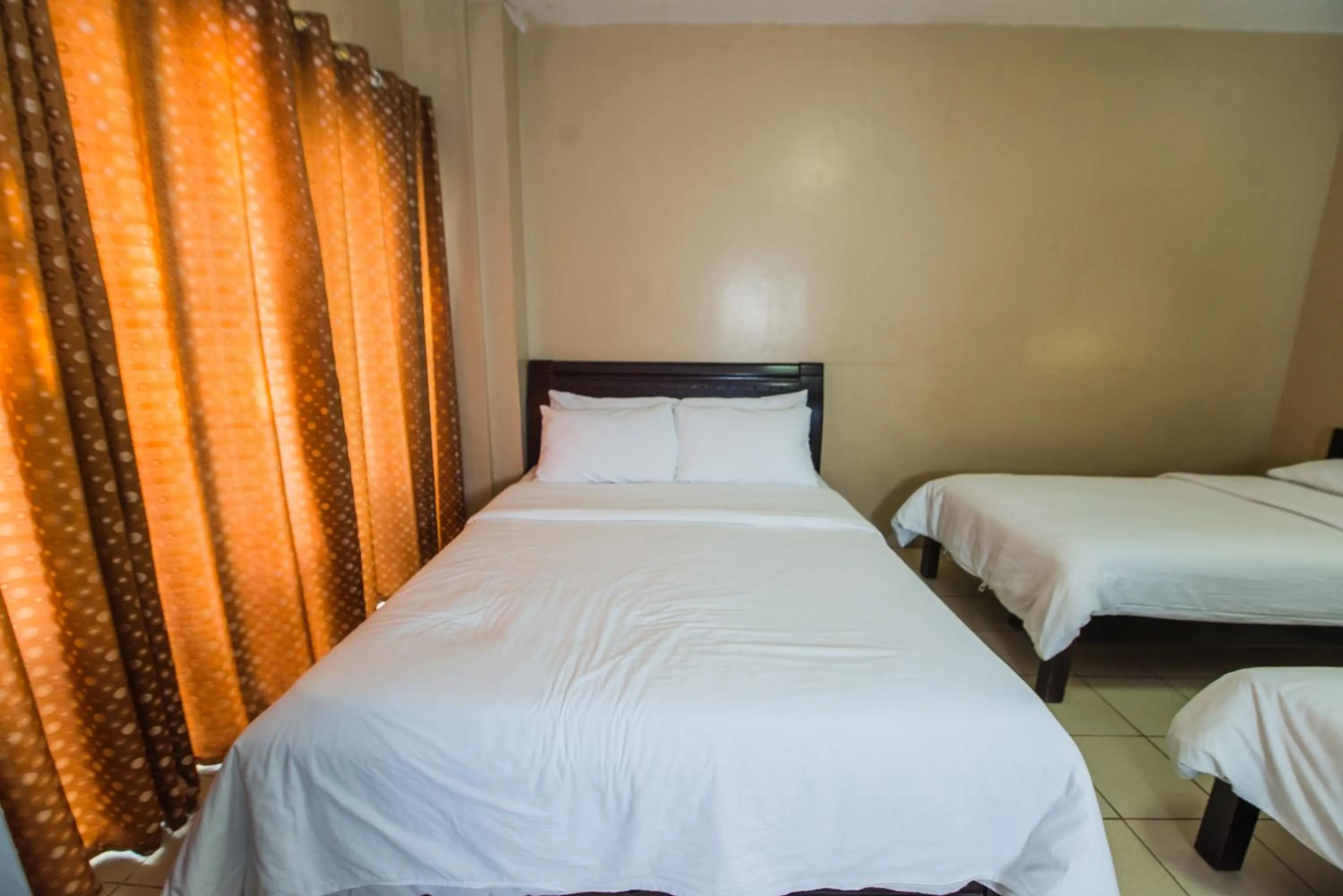 Bed in Northland Resort Hotel Manapla