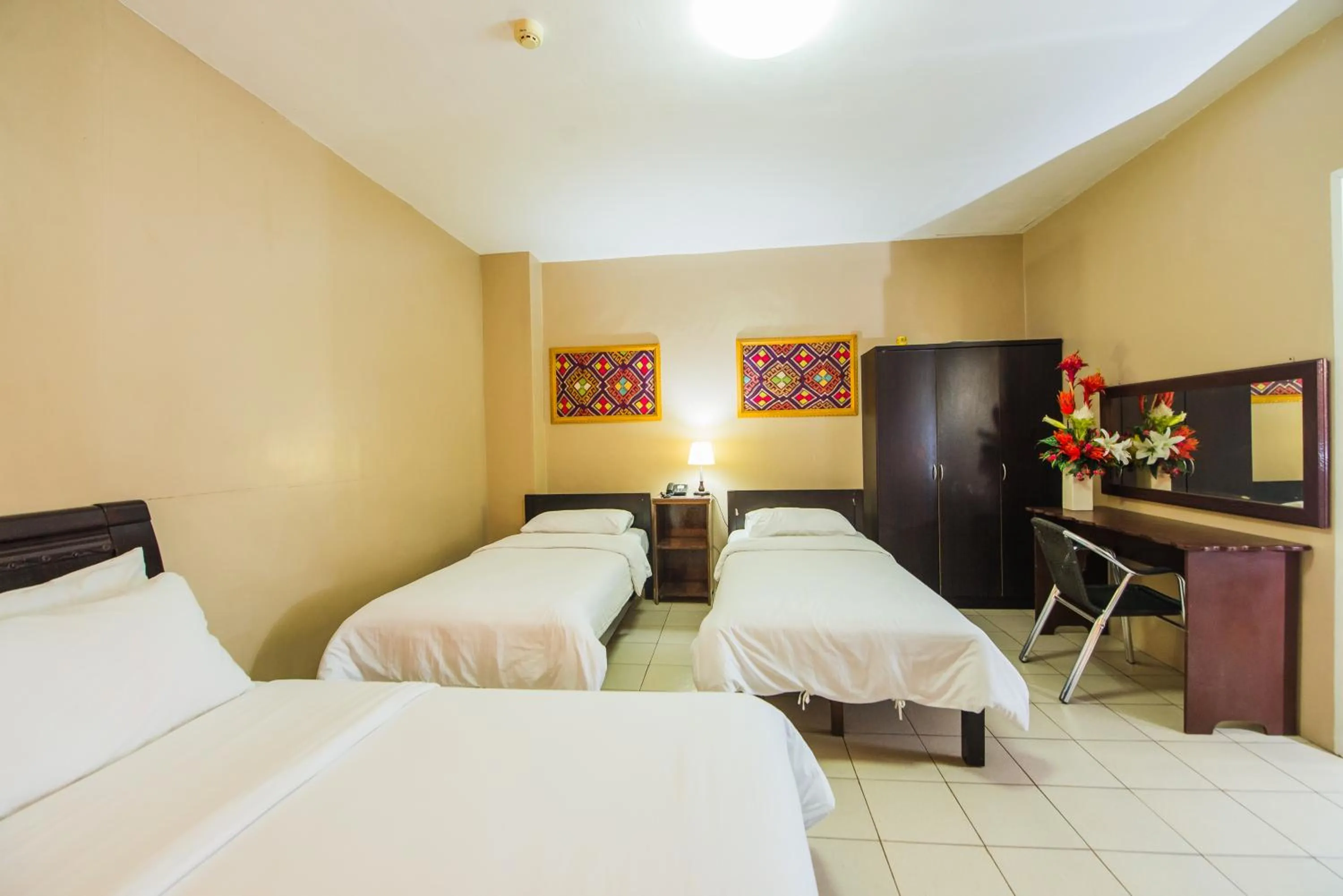 Bed in Northland Resort Hotel Manapla