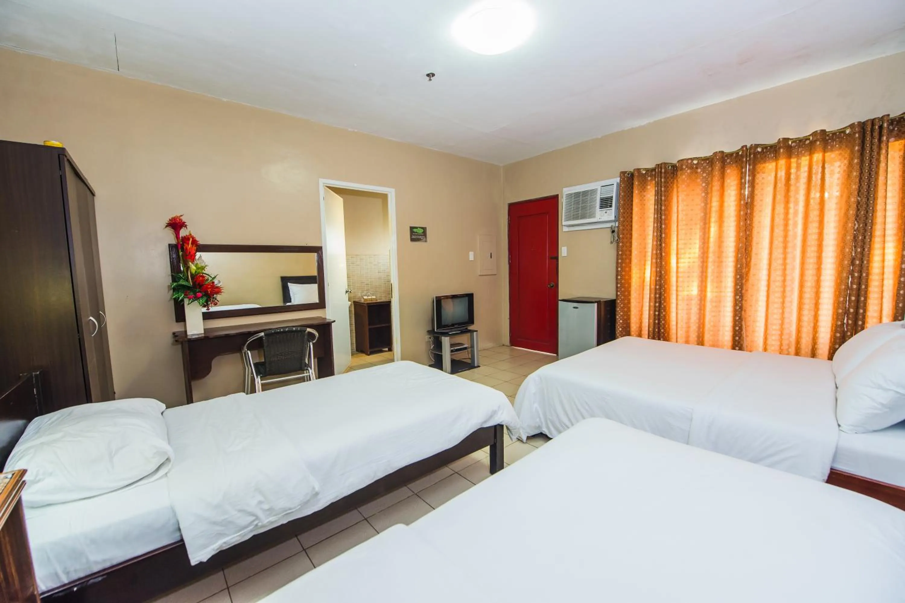 Bed in Northland Resort Hotel Manapla