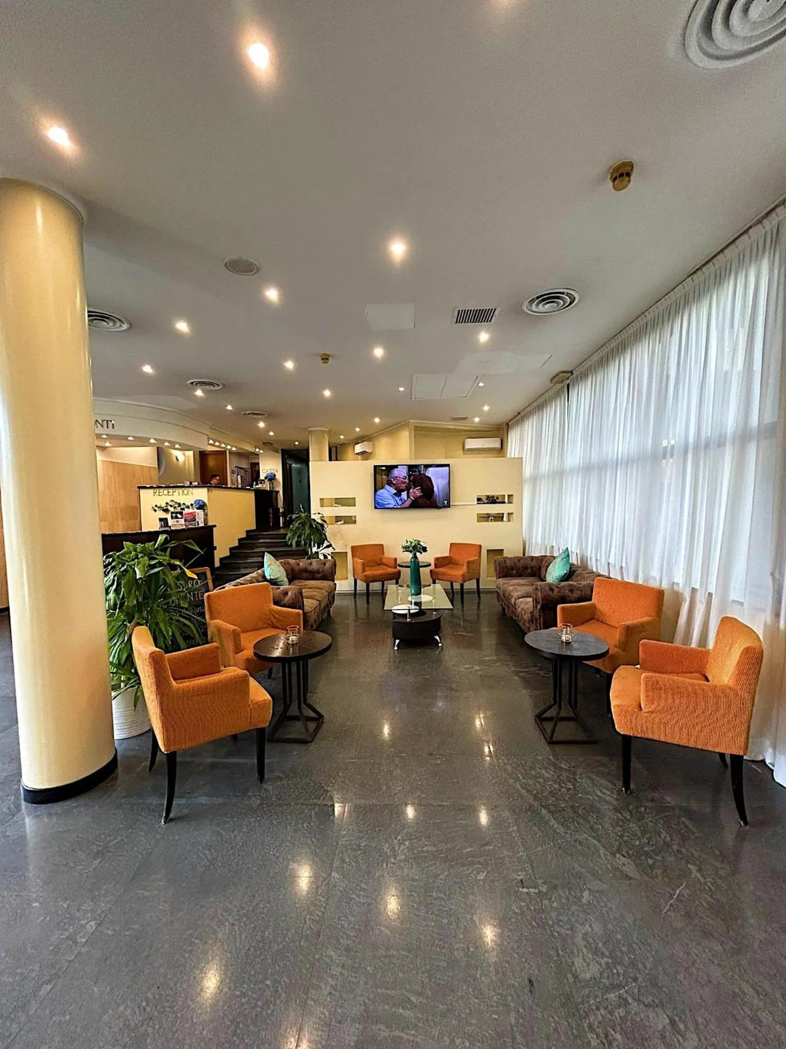 Communal lounge/ TV room in iH Hotels Milano Blu Visconti