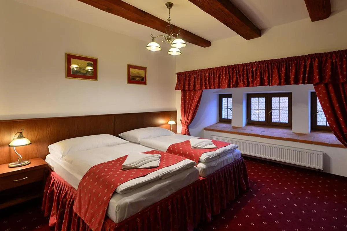 Bed in Hotel Malý Pivovar