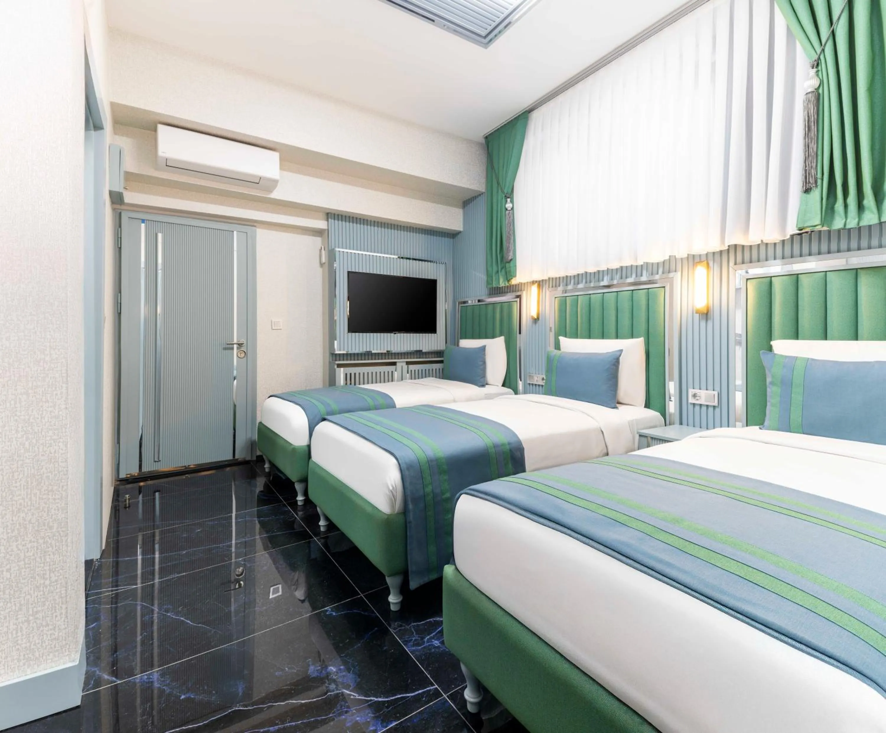 Bed in Santa Rio Gold Taxim Hotel