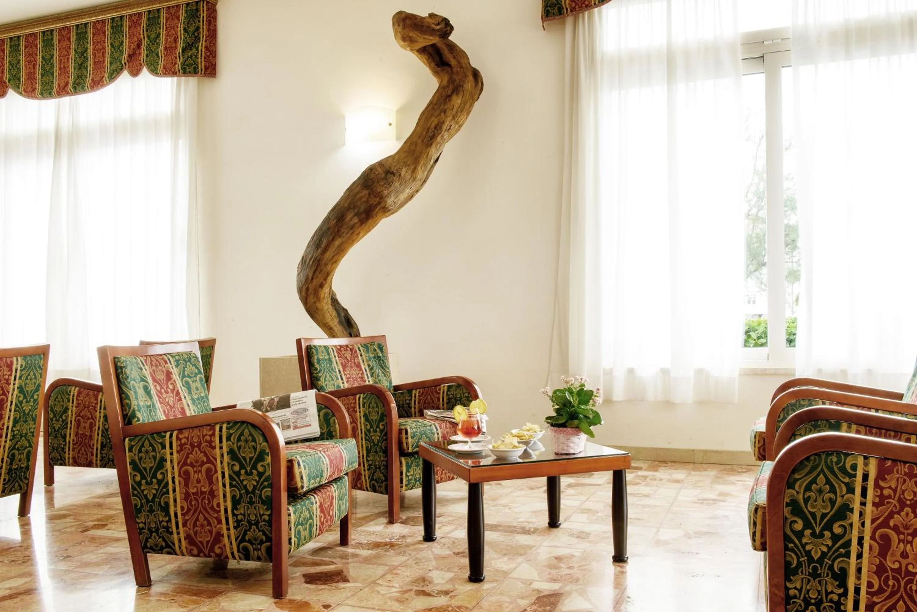 Communal lounge/ TV room in Hotel Capri & Residence