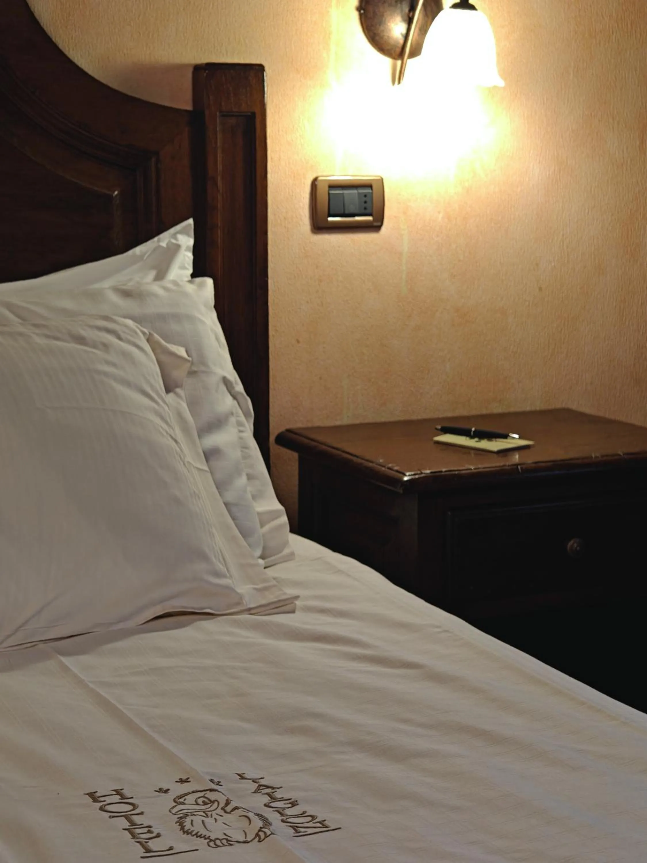 Bed in Hotel L' Aiglon